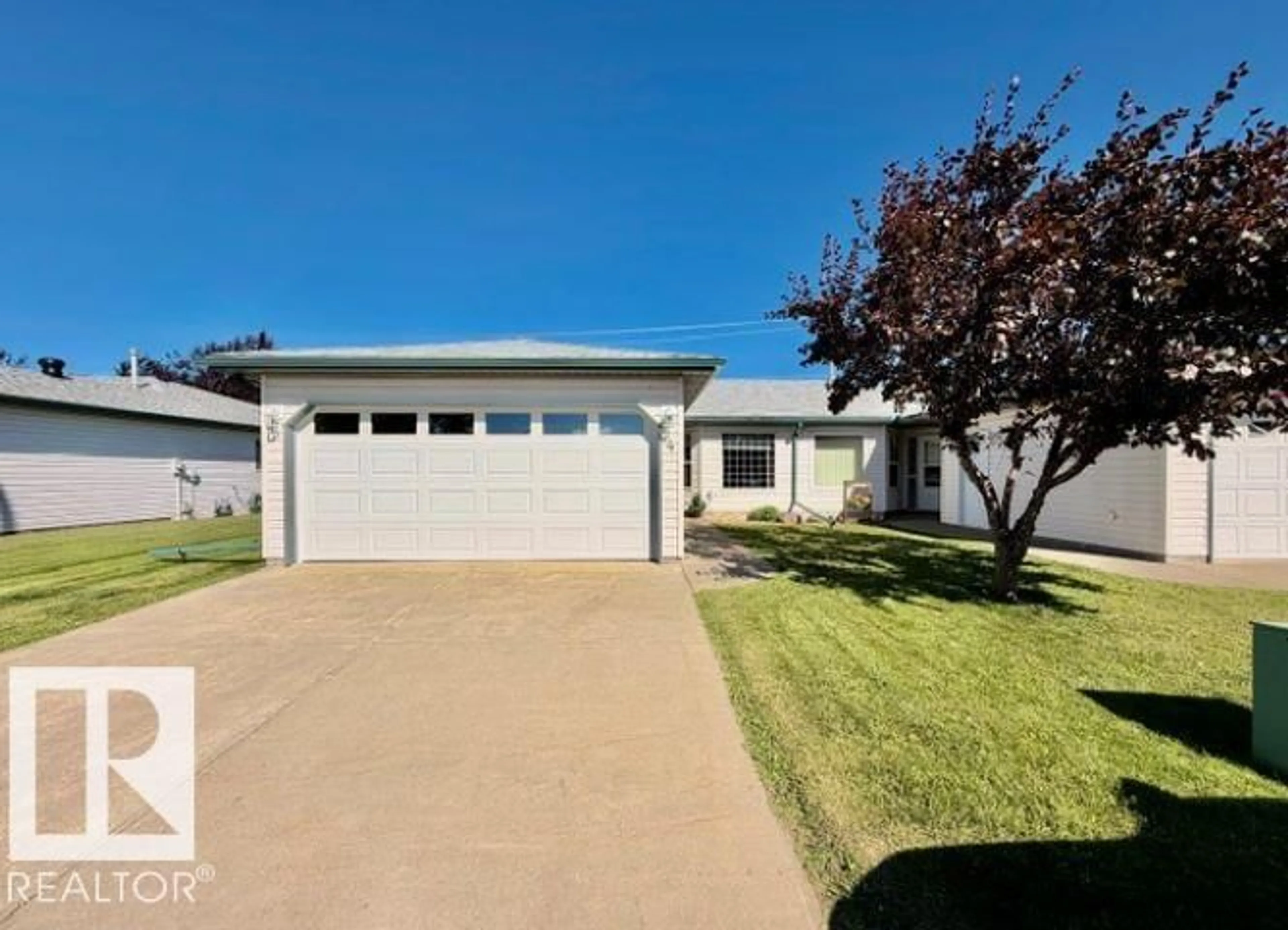 Home with vinyl exterior material, street for #4 - 5714 50 ST, Wetaskiwin Alberta T9A3R3