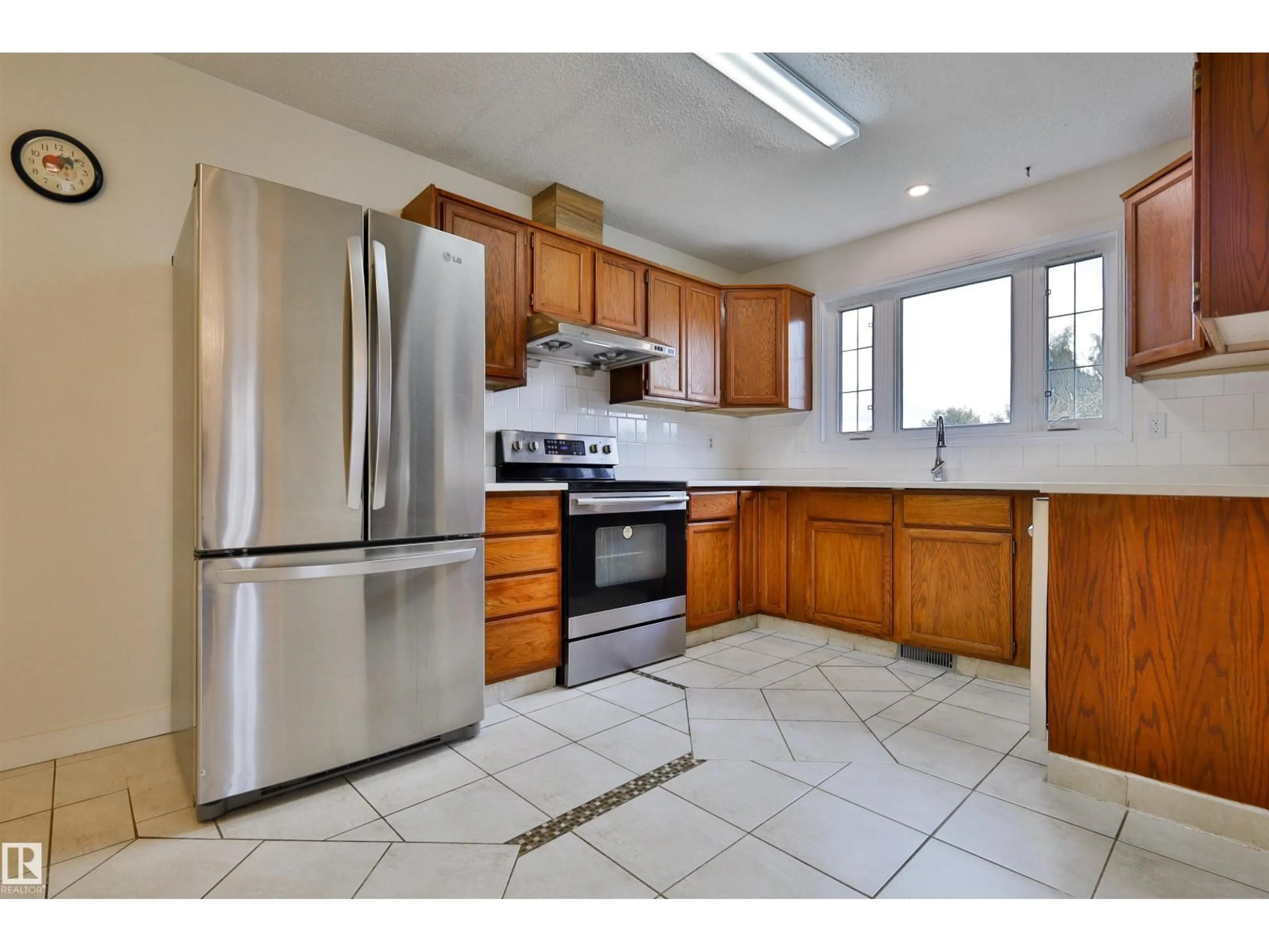 Standard kitchen, ceramic/tile floor for 12229 39 ST, Edmonton Alberta T5W2K2