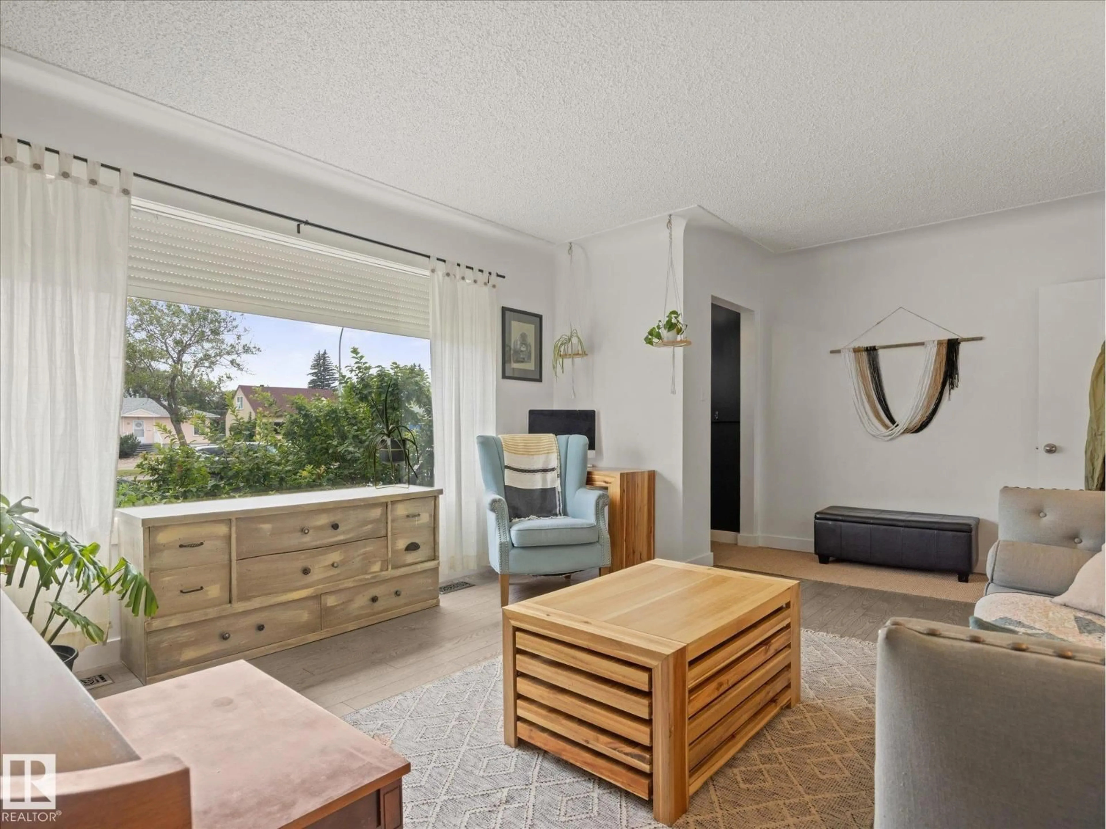 Living room with furniture, wood/laminate floor for 11949 ST ALBERT TR, Edmonton Alberta T5L4G5