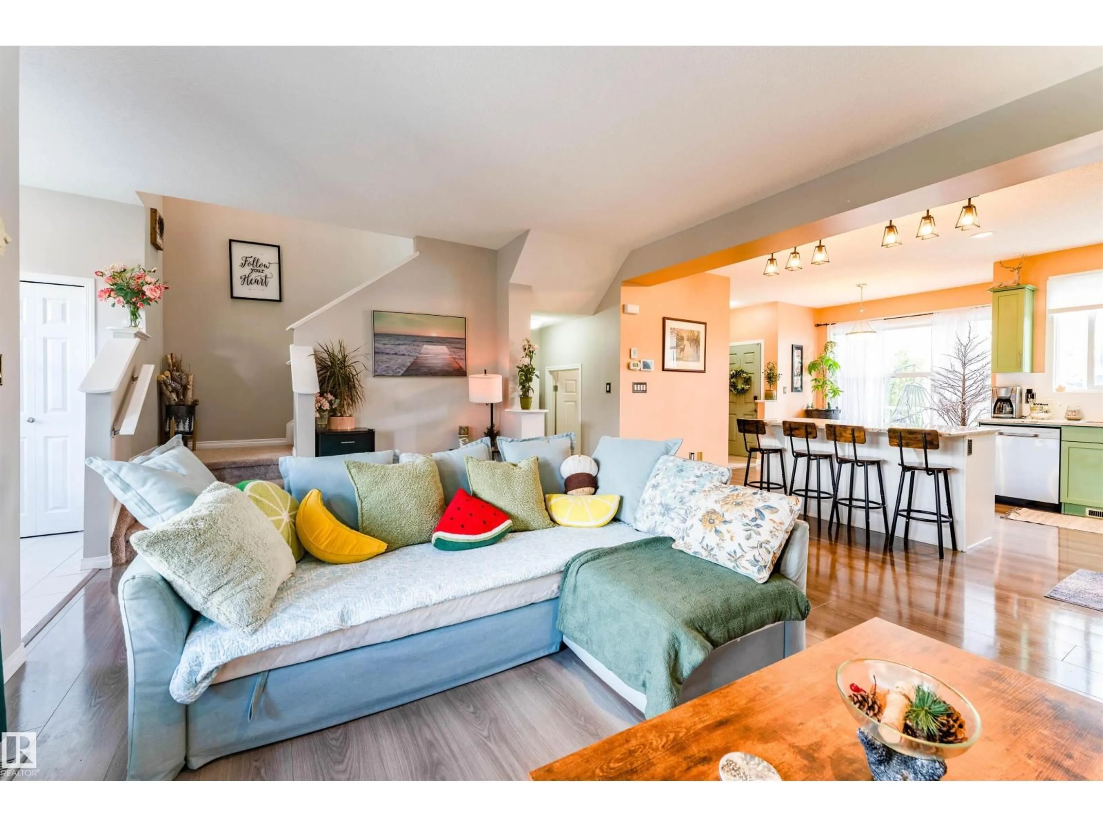 Living room with furniture, wood/laminate floor for 725 SECORD BV, Edmonton Alberta T5T7A8