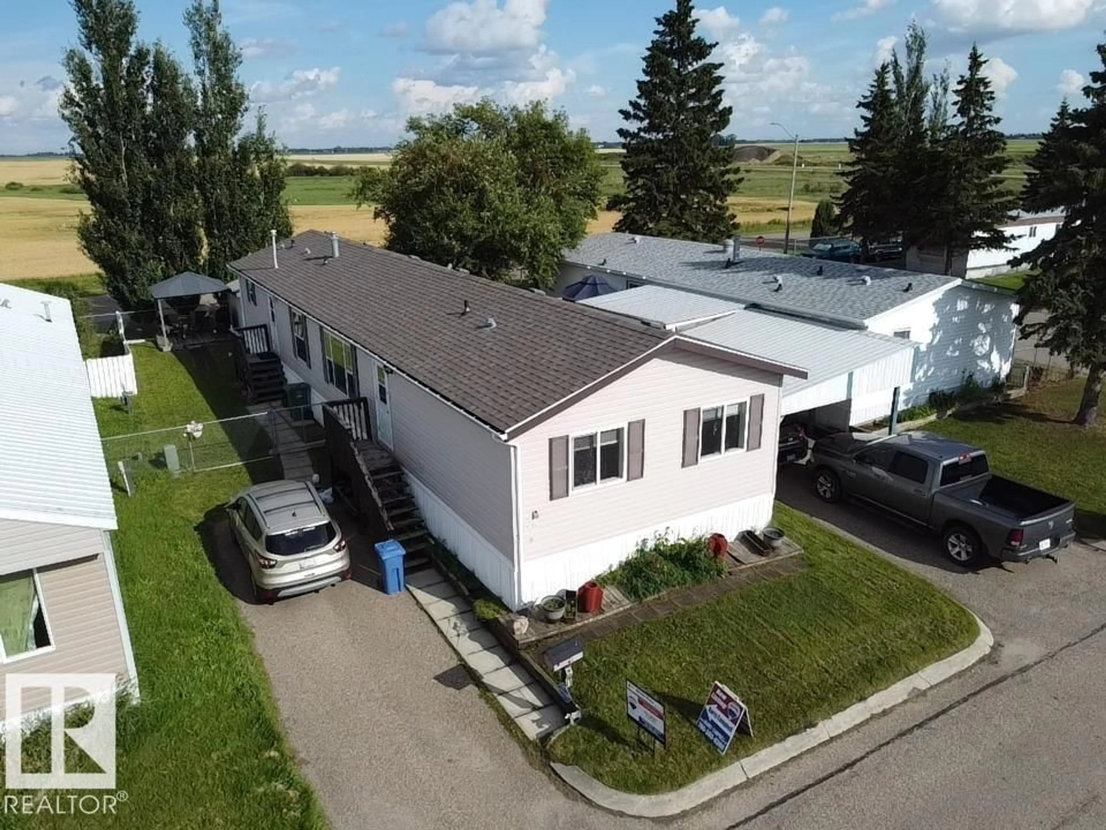 A pic from outside/outdoor area/front of a property/back of a property/a pic from drone, building for #56 - 4202 45 ST, Wetaskiwin Alberta T9A2L3