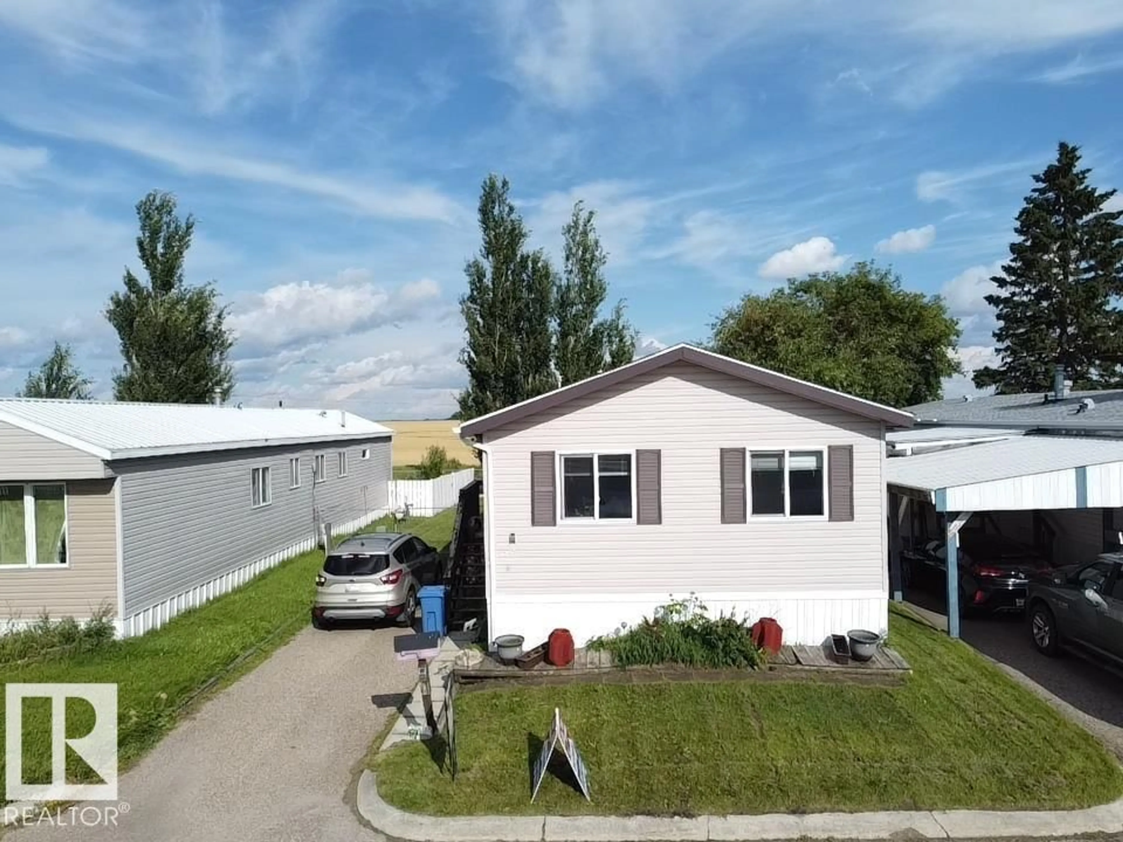 Home with vinyl exterior material, street for #56 - 4202 45 ST, Wetaskiwin Alberta T9A2L3