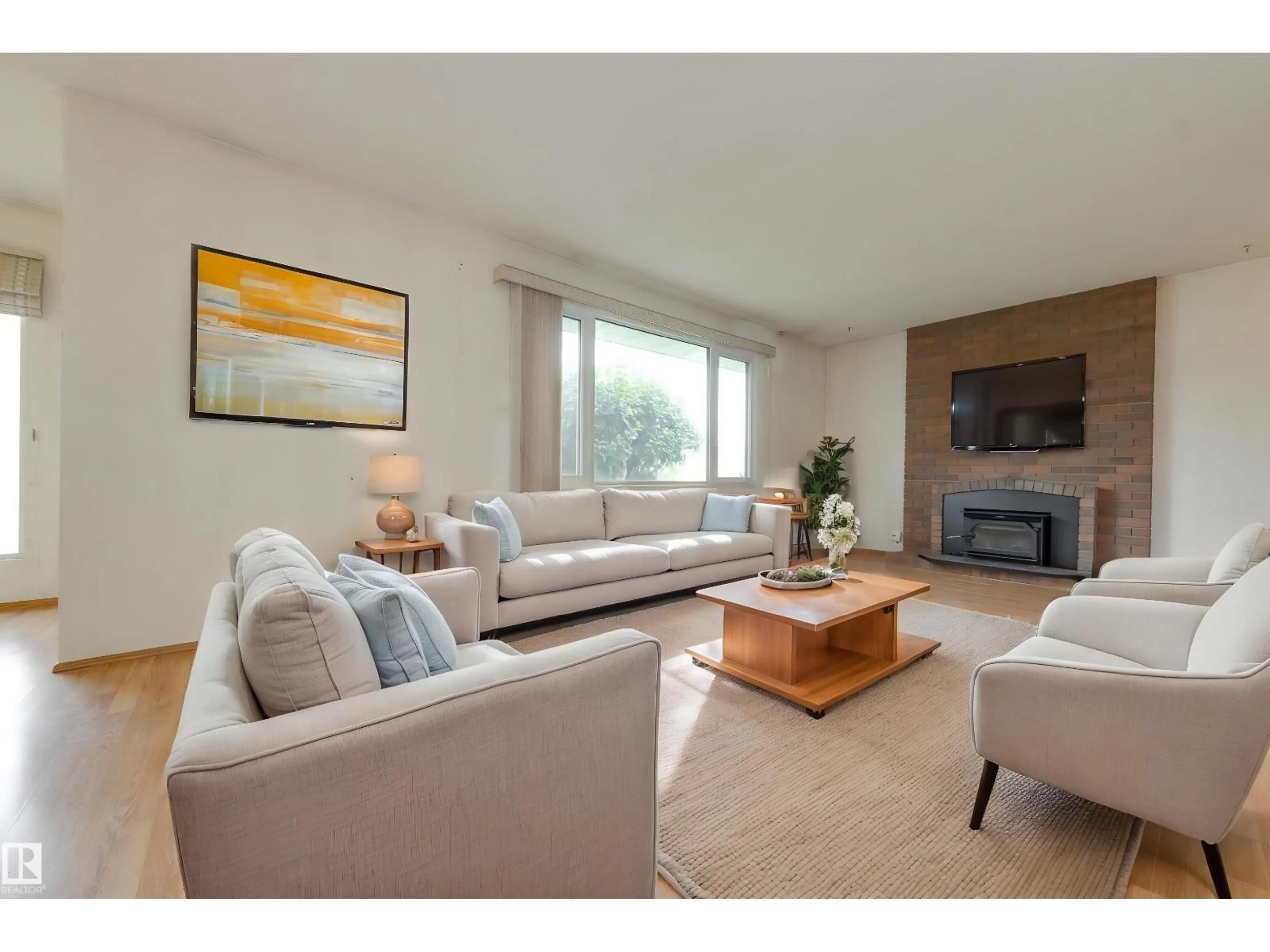 Living room with furniture, wood/laminate floor for NW - 13816 90 ST, Edmonton Alberta T5E3N3