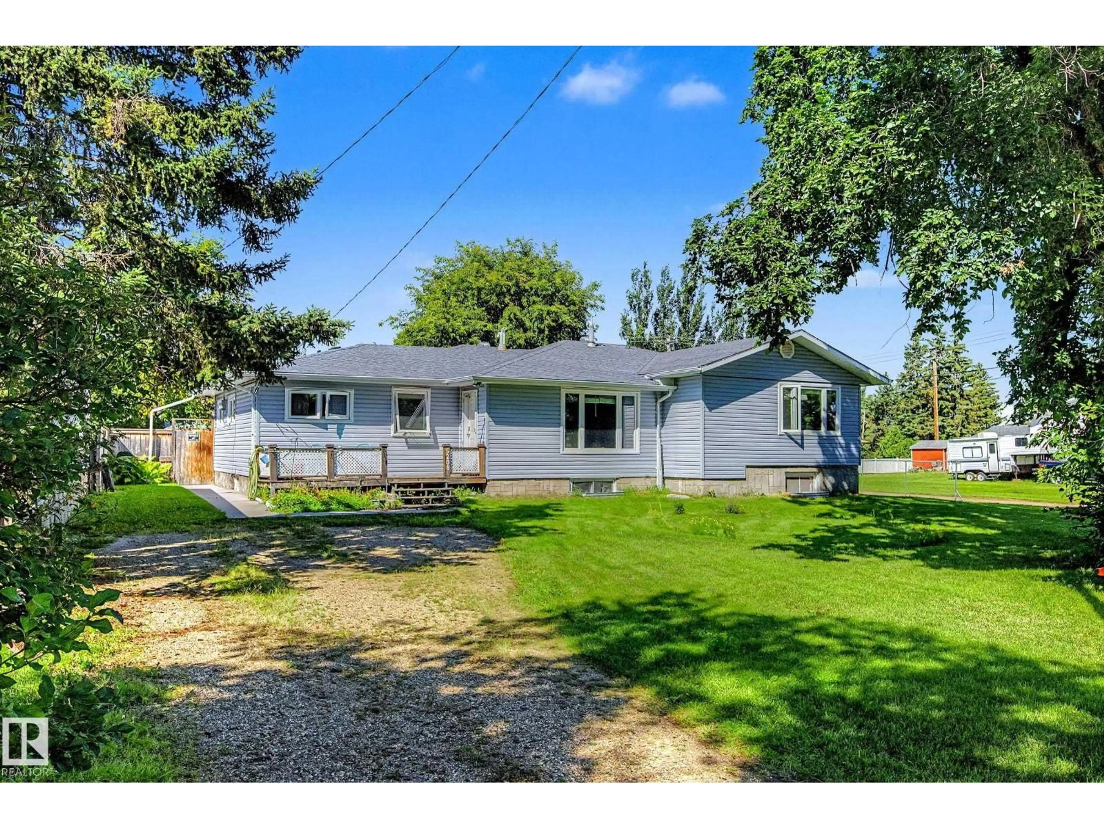 Home with vinyl exterior material, street for 5208 51 ST, Millet Alberta T0C1Z0