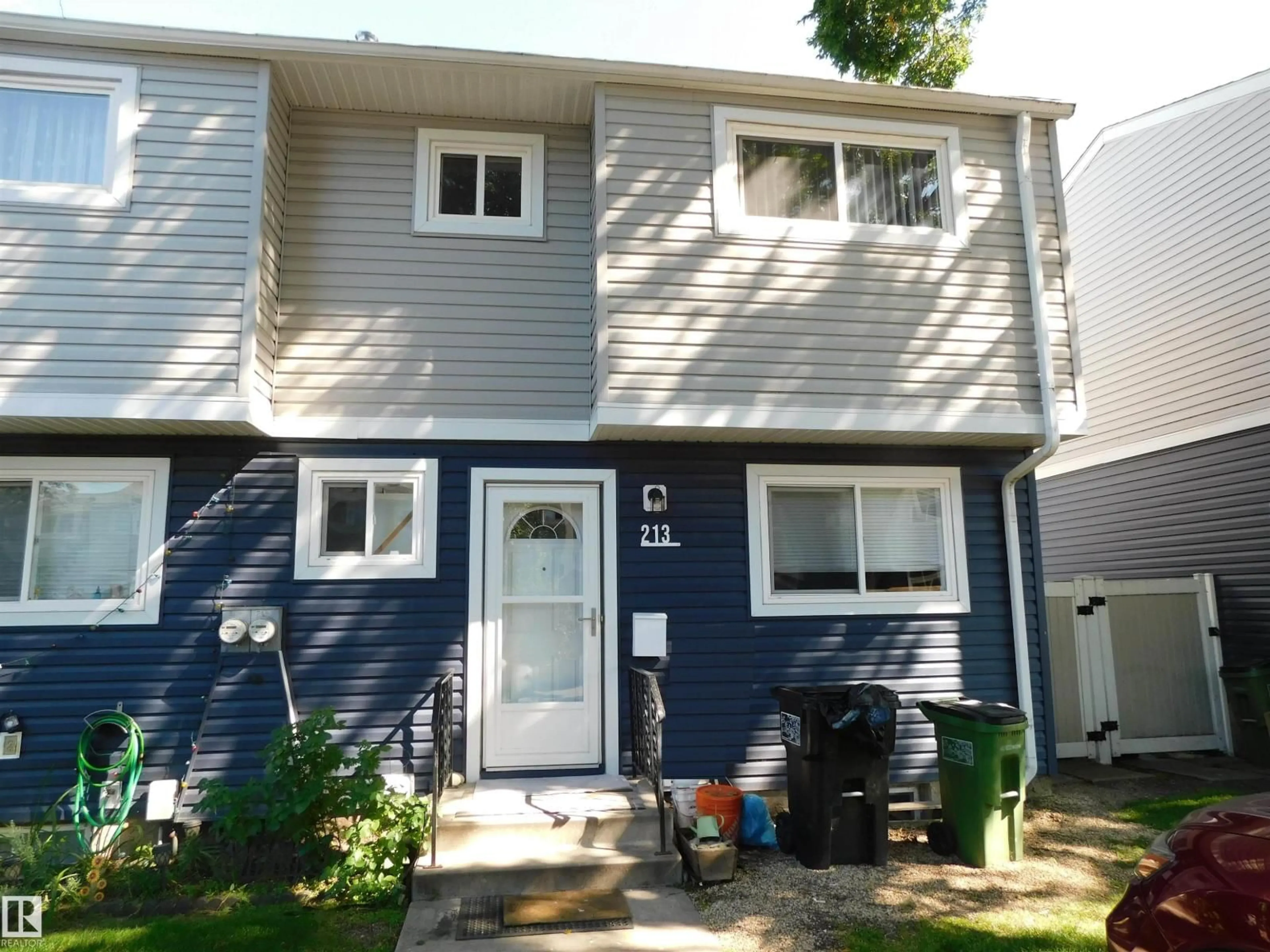 Home with vinyl exterior material, street for 213 HABITAT CR, Edmonton Alberta T5A3K8