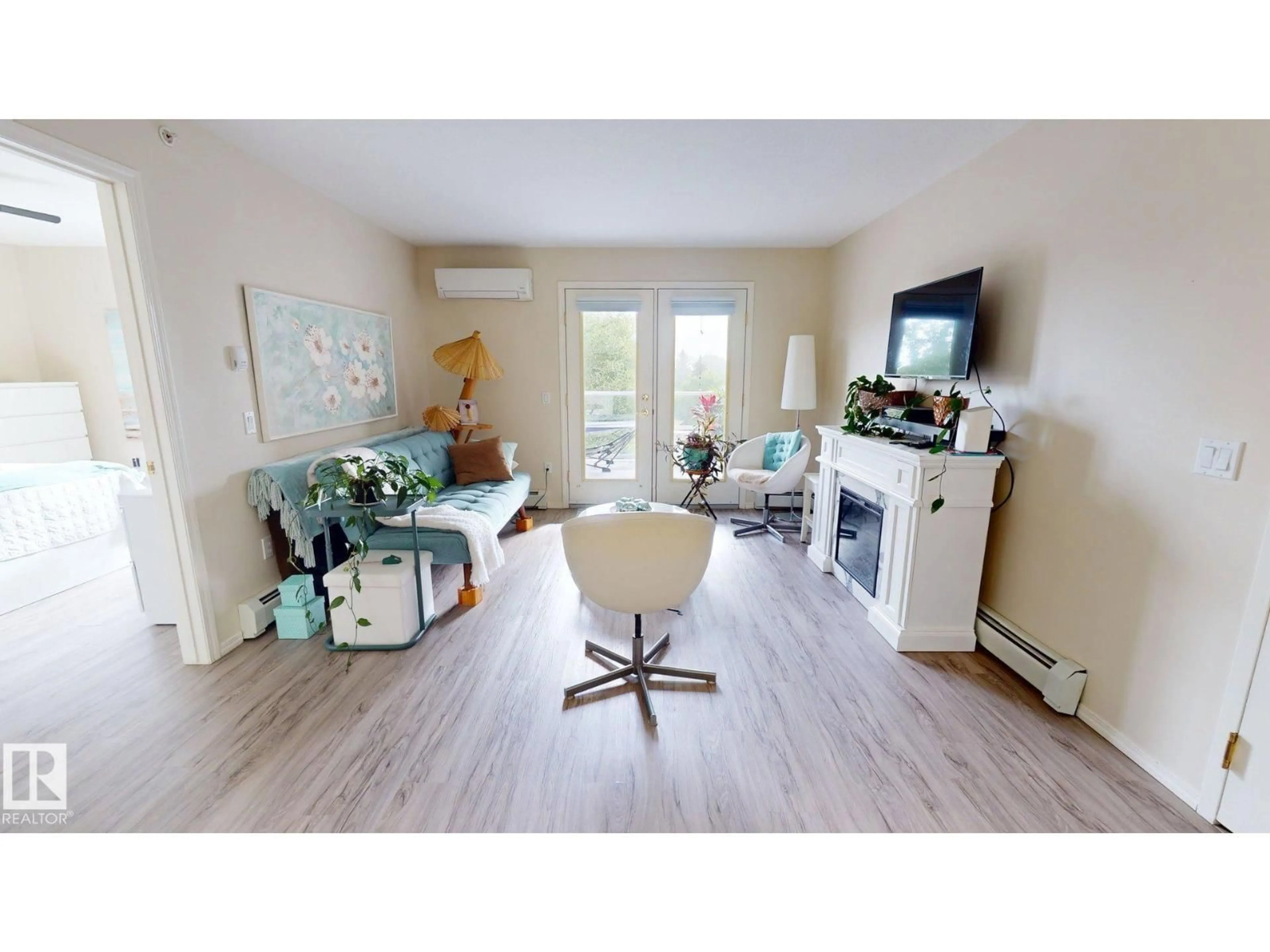 Living room with furniture, wood/laminate floor for #402 - 78 MCKENNEY AV, St. Albert Alberta T8N1L9