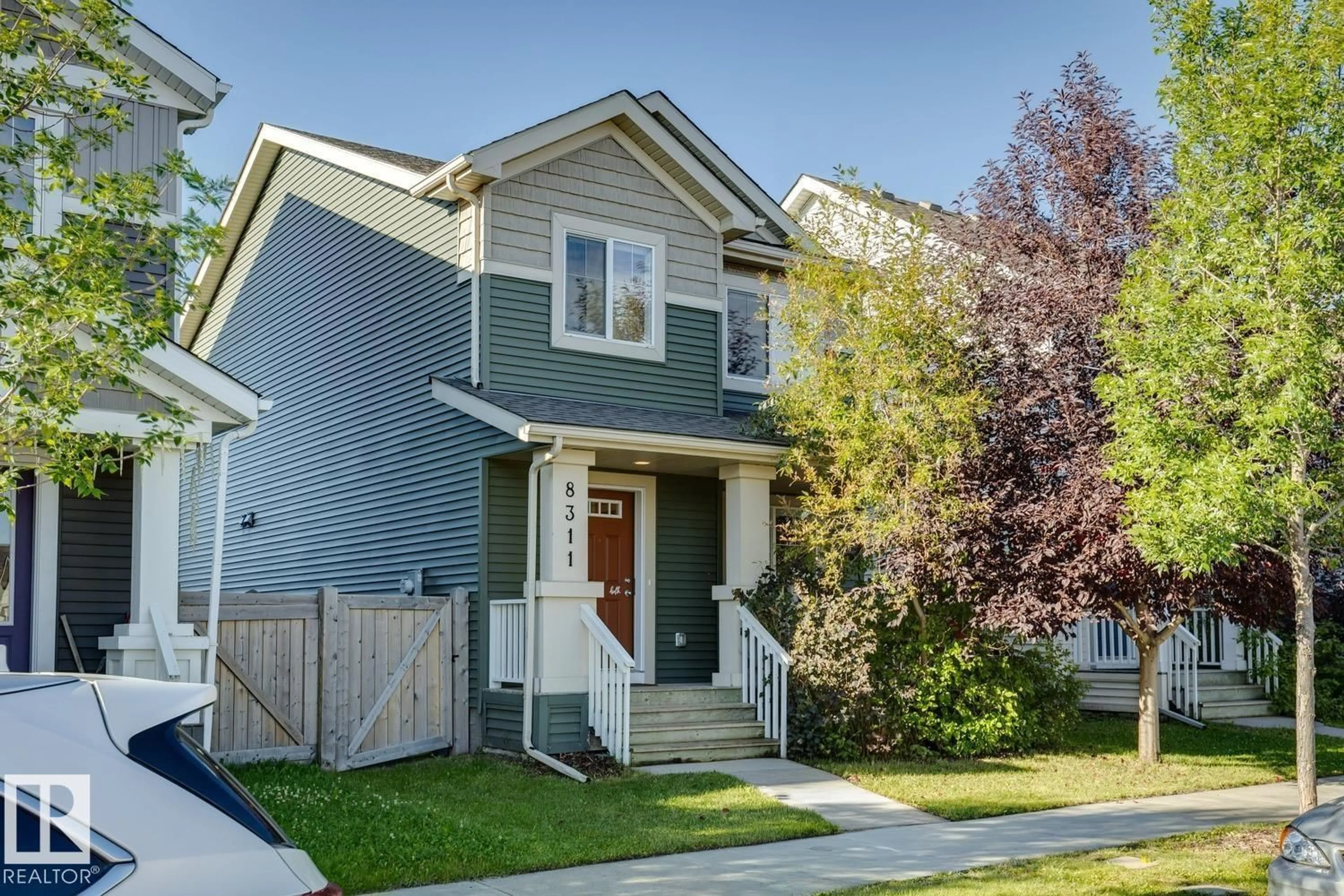 Home with vinyl exterior material, street for 8311 ELLIS CR, Edmonton Alberta T6M0P8