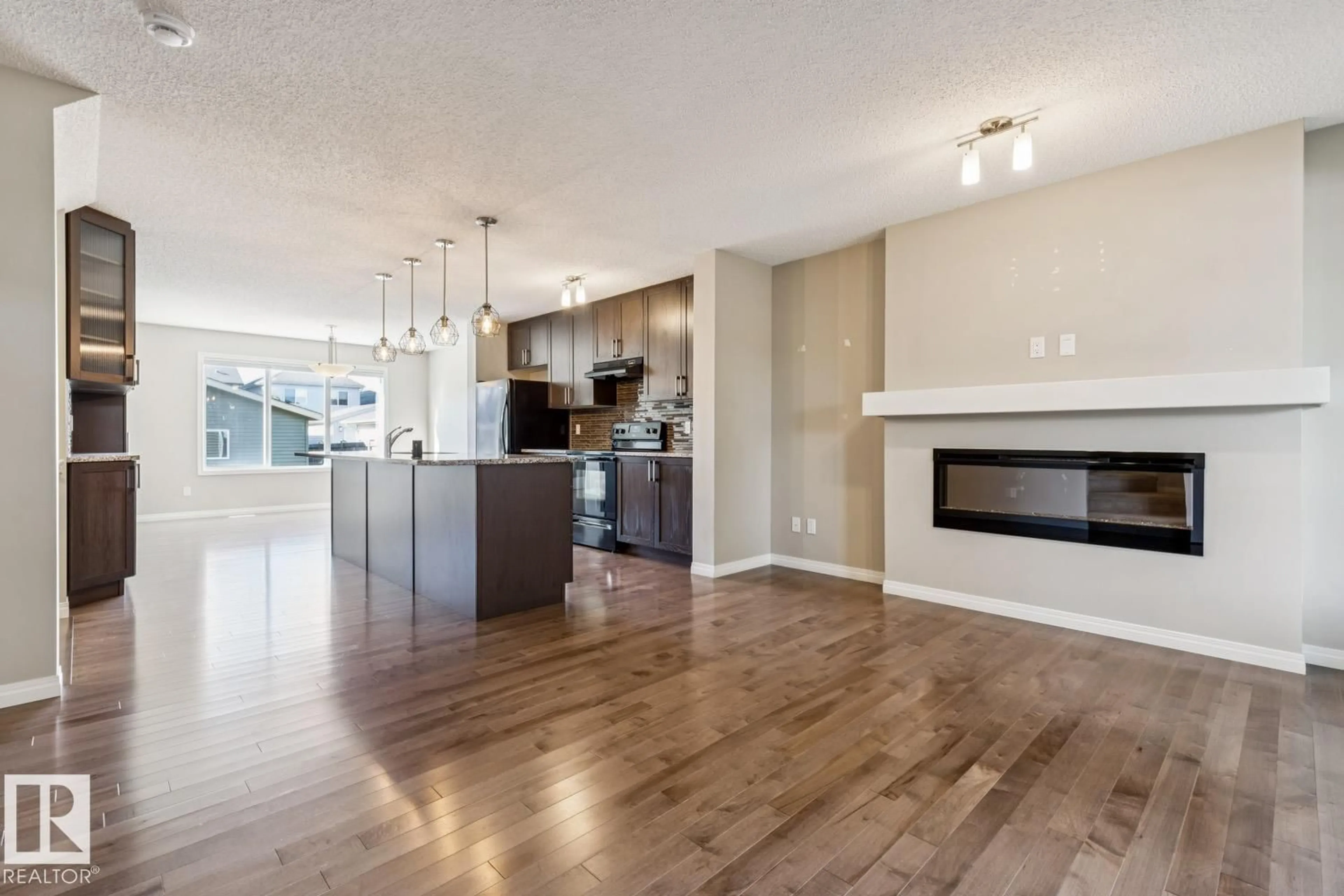Open concept kitchen, wood/laminate floor for 8311 ELLIS CR, Edmonton Alberta T6M0P8