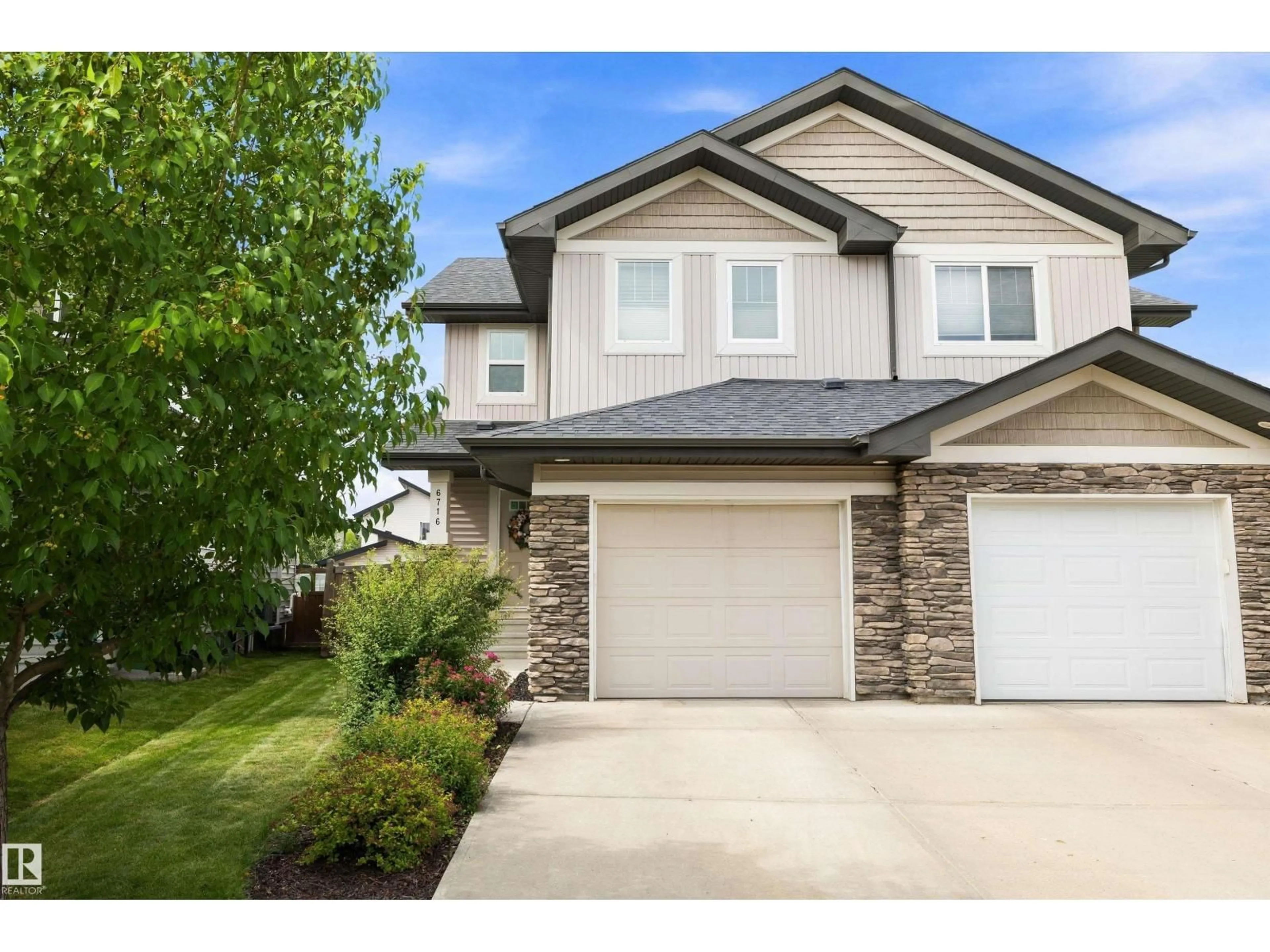 Home with vinyl exterior material, street for 6716 CARDINAL RD, Edmonton Alberta T6W2Y6