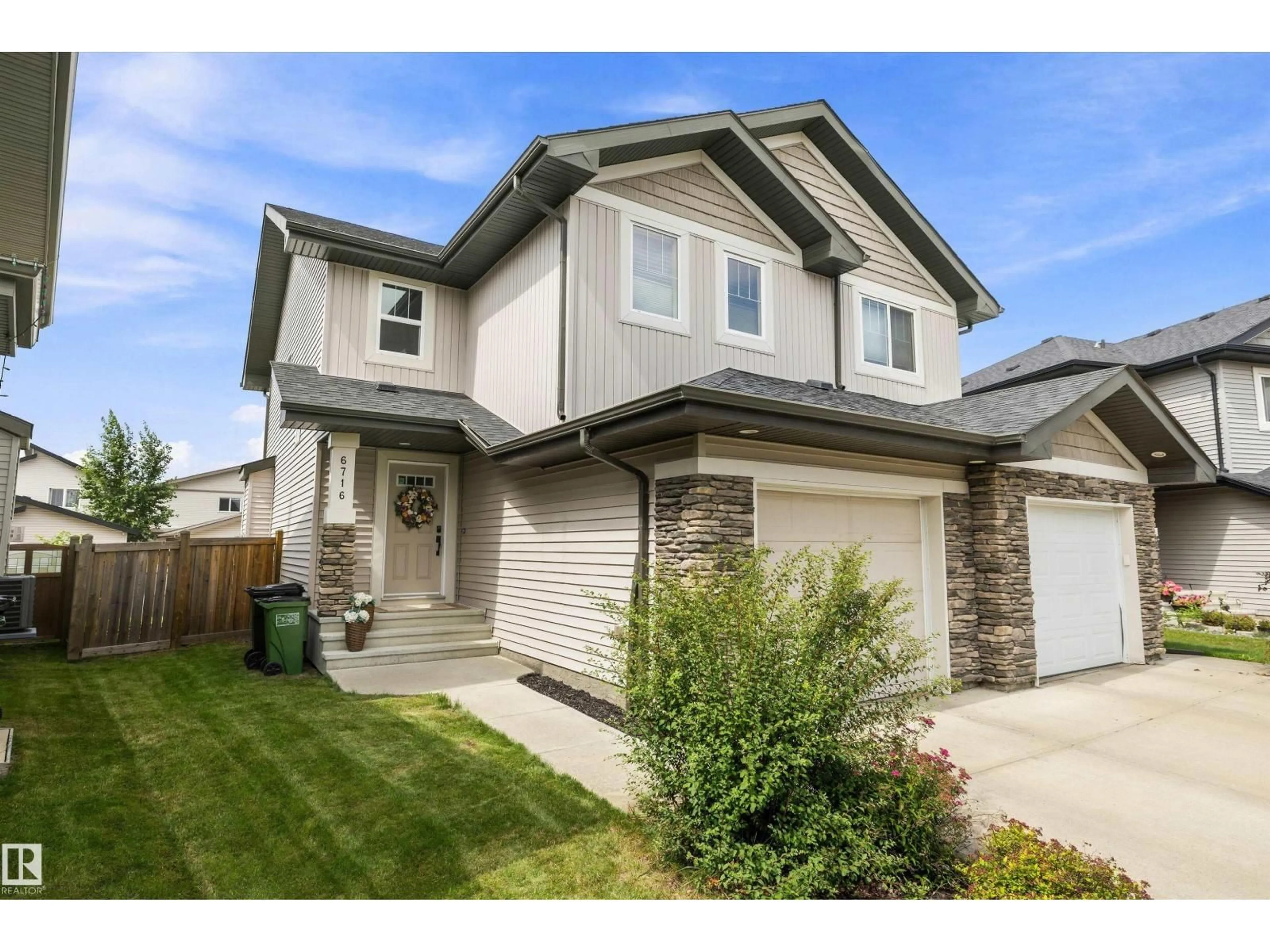 Home with vinyl exterior material, street for 6716 CARDINAL RD, Edmonton Alberta T6W2Y6