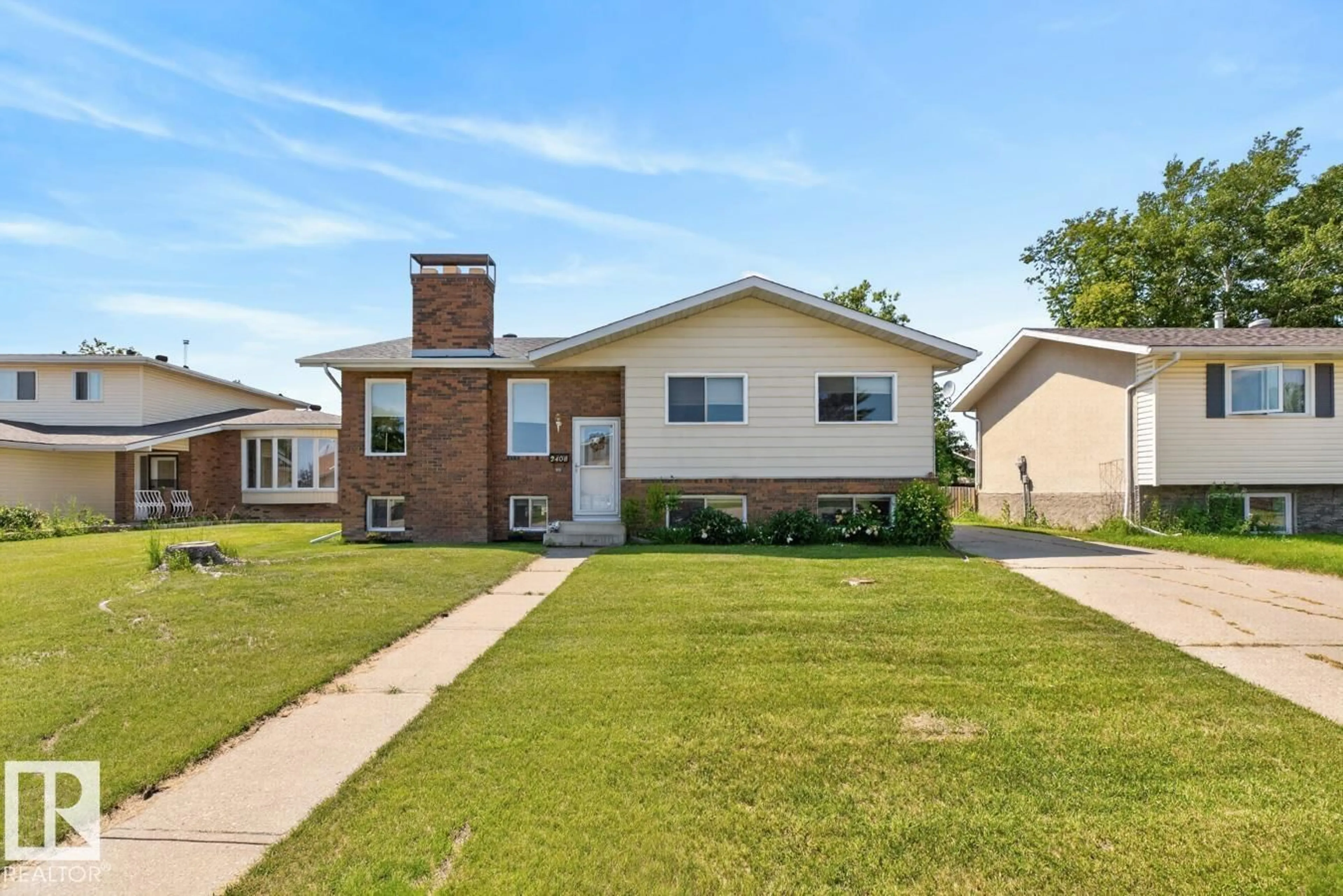 Home with brick exterior material, street for 2408 80 ST, Edmonton Alberta T6K3P6