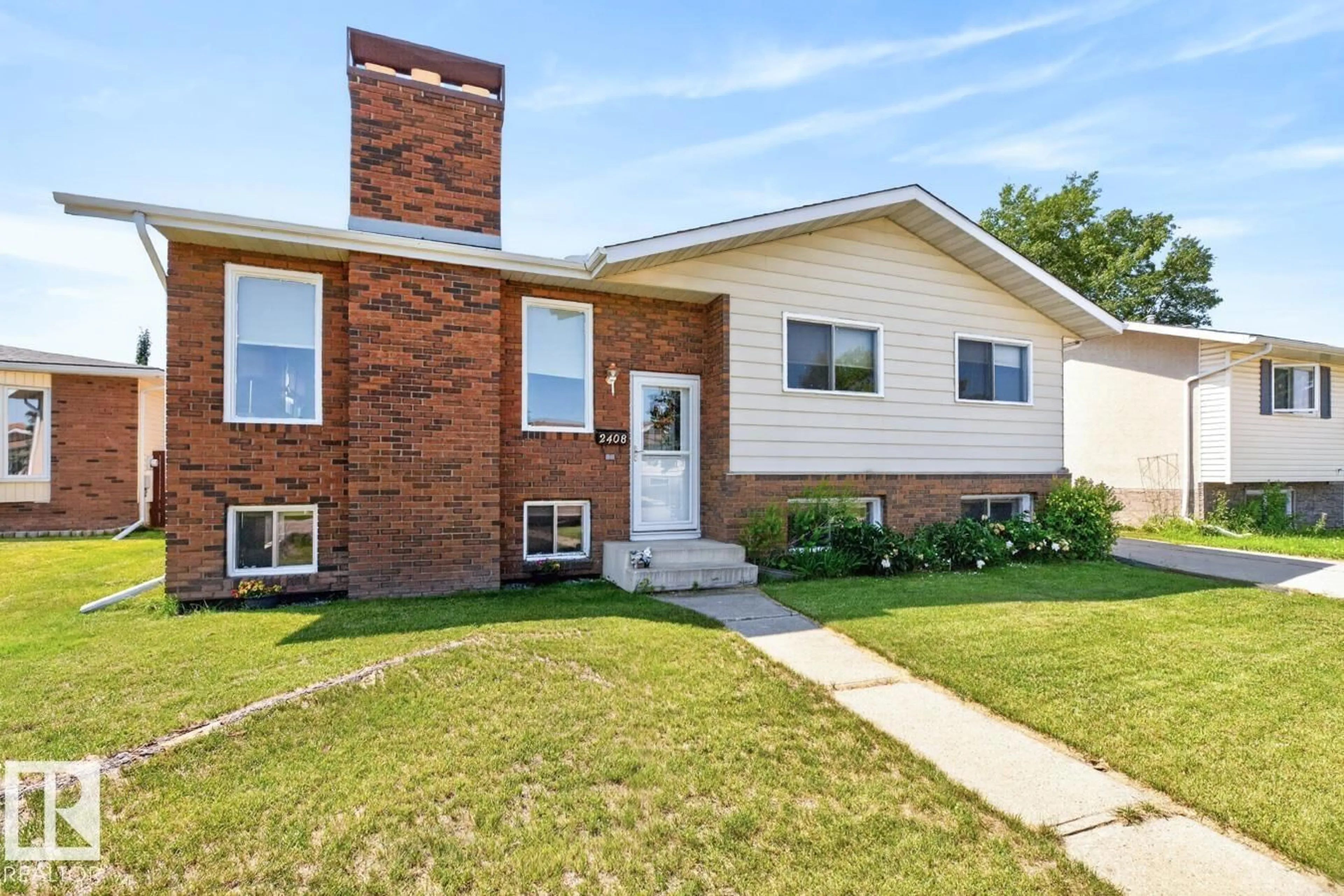 Home with brick exterior material, street for 2408 80 ST, Edmonton Alberta T6K3P6