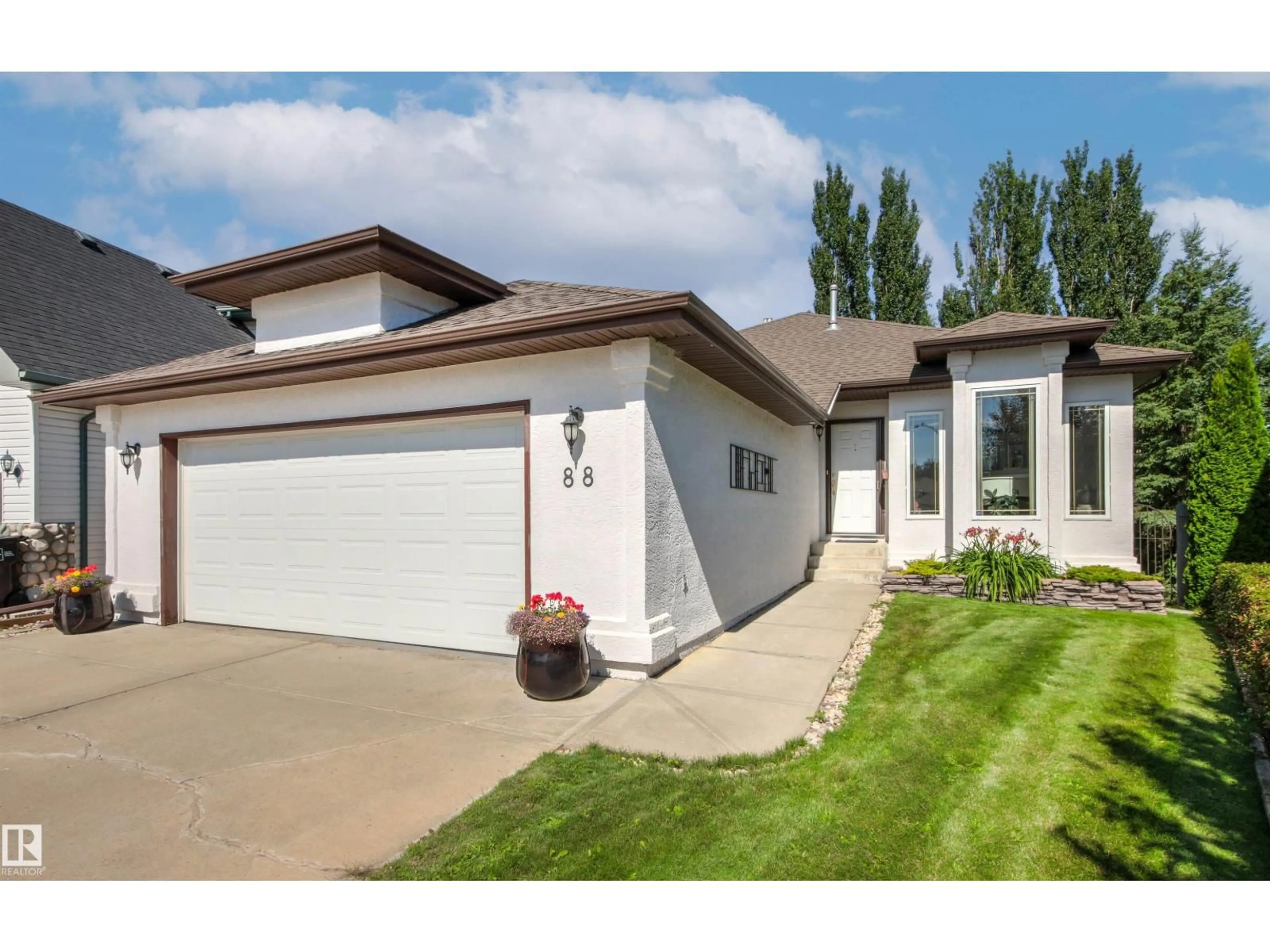 Home with vinyl exterior material, street for 88 DECHENE RD, Edmonton Alberta T6M2S4