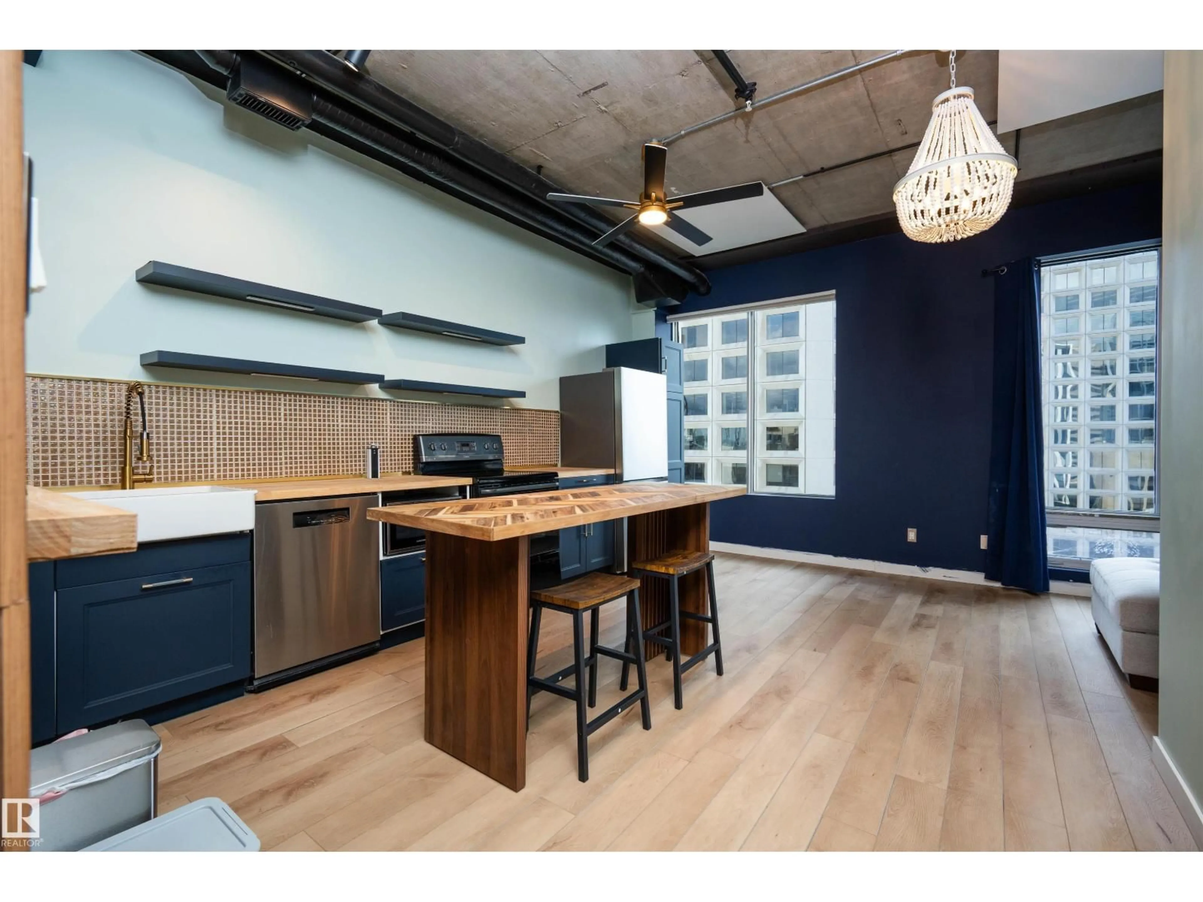 Open concept kitchen, wood/laminate floor for 10024 - 913 JASPER AV, Edmonton Alberta T5J1R9