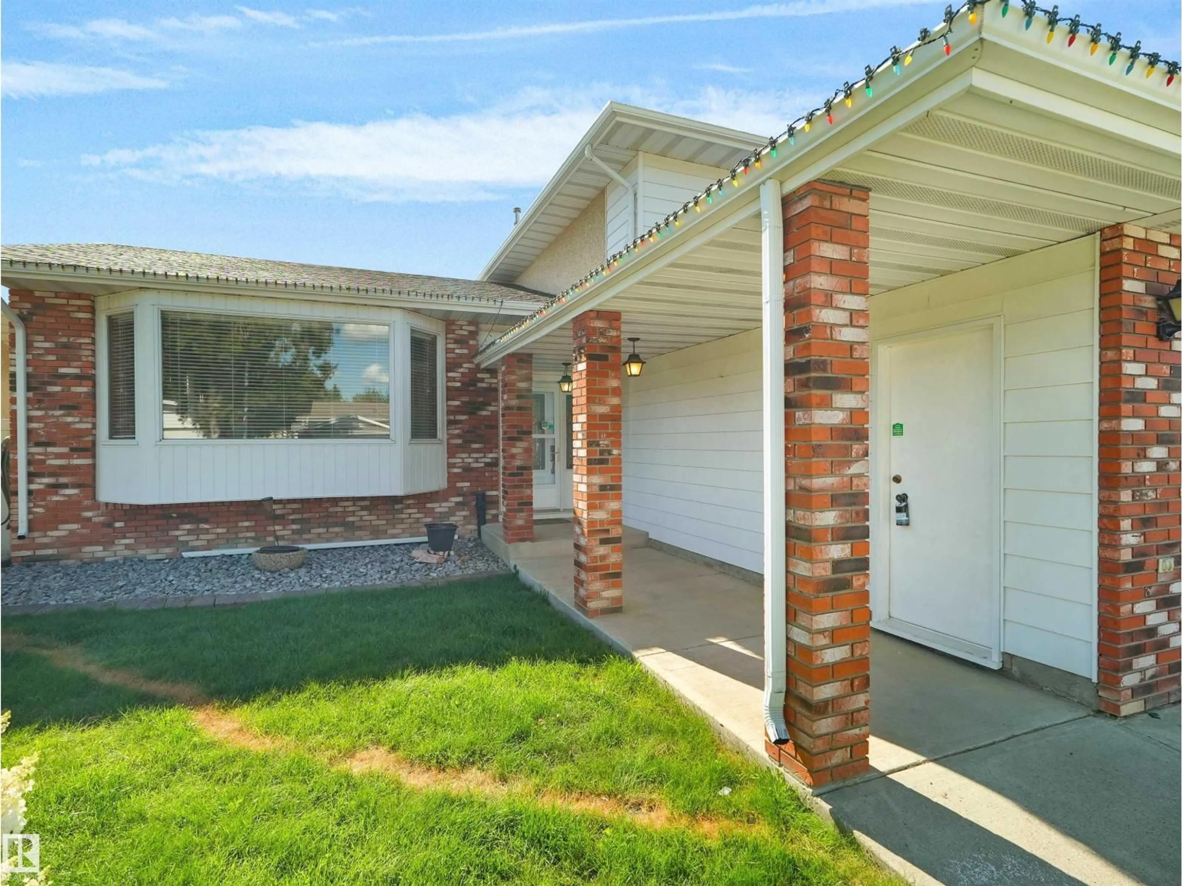 Home with brick exterior material, street for NW - 7357 18 AV, Edmonton Alberta T6K2B5