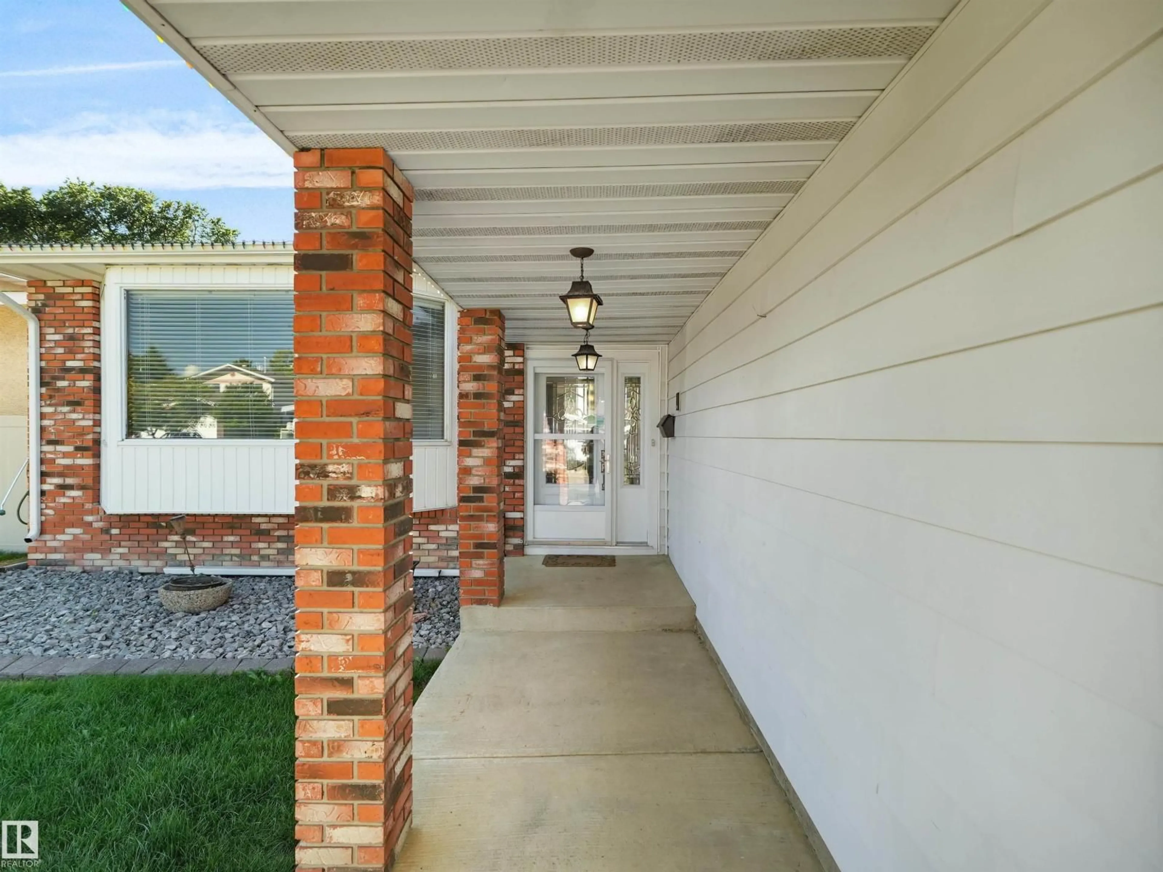 Home with brick exterior material, street for NW - 7357 18 AV, Edmonton Alberta T6K2B5