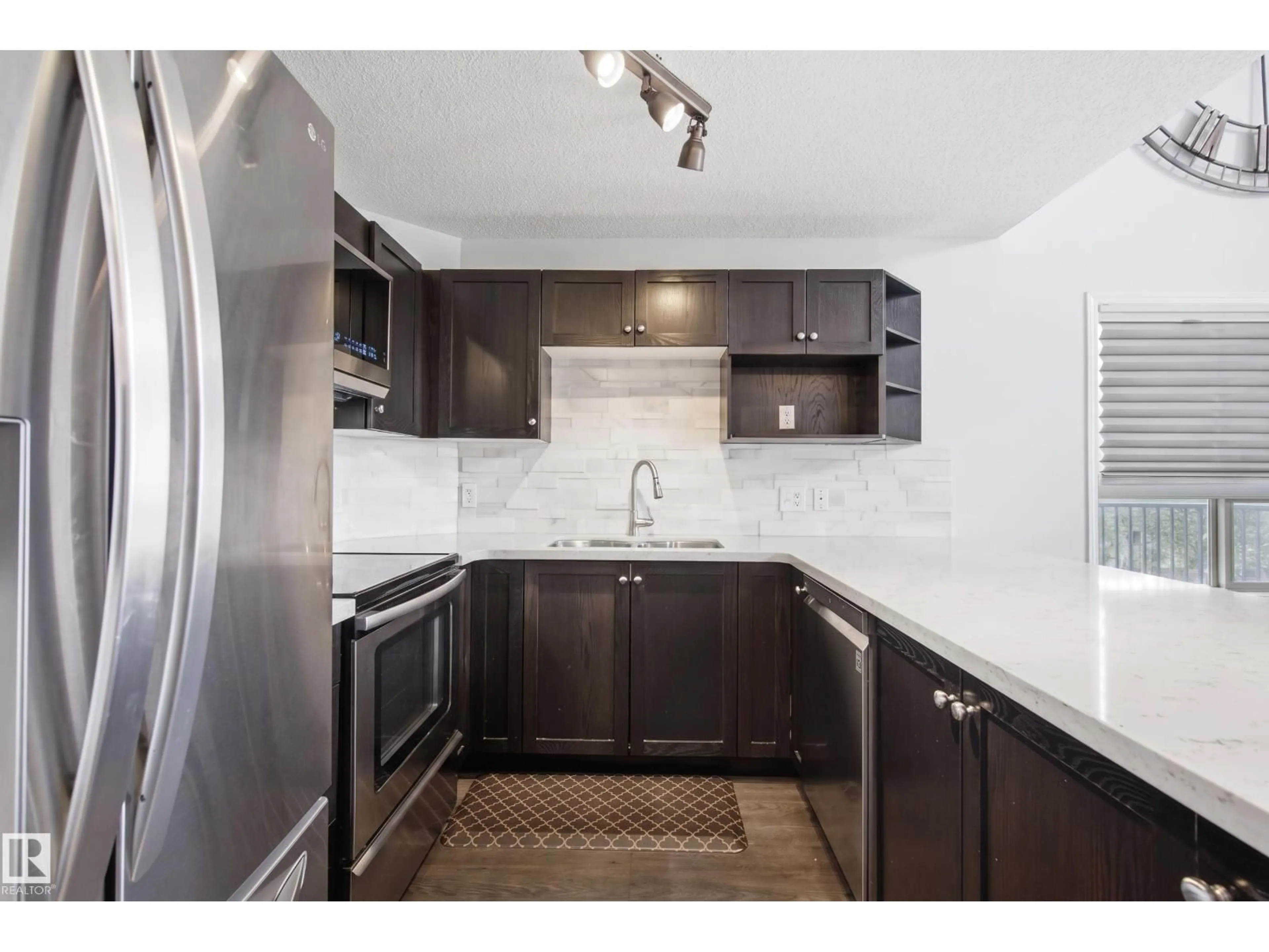 Standard kitchen, ceramic/tile floor for 9357 - 2415 SIMPOSON DR, Edmonton Alberta T6R0N3
