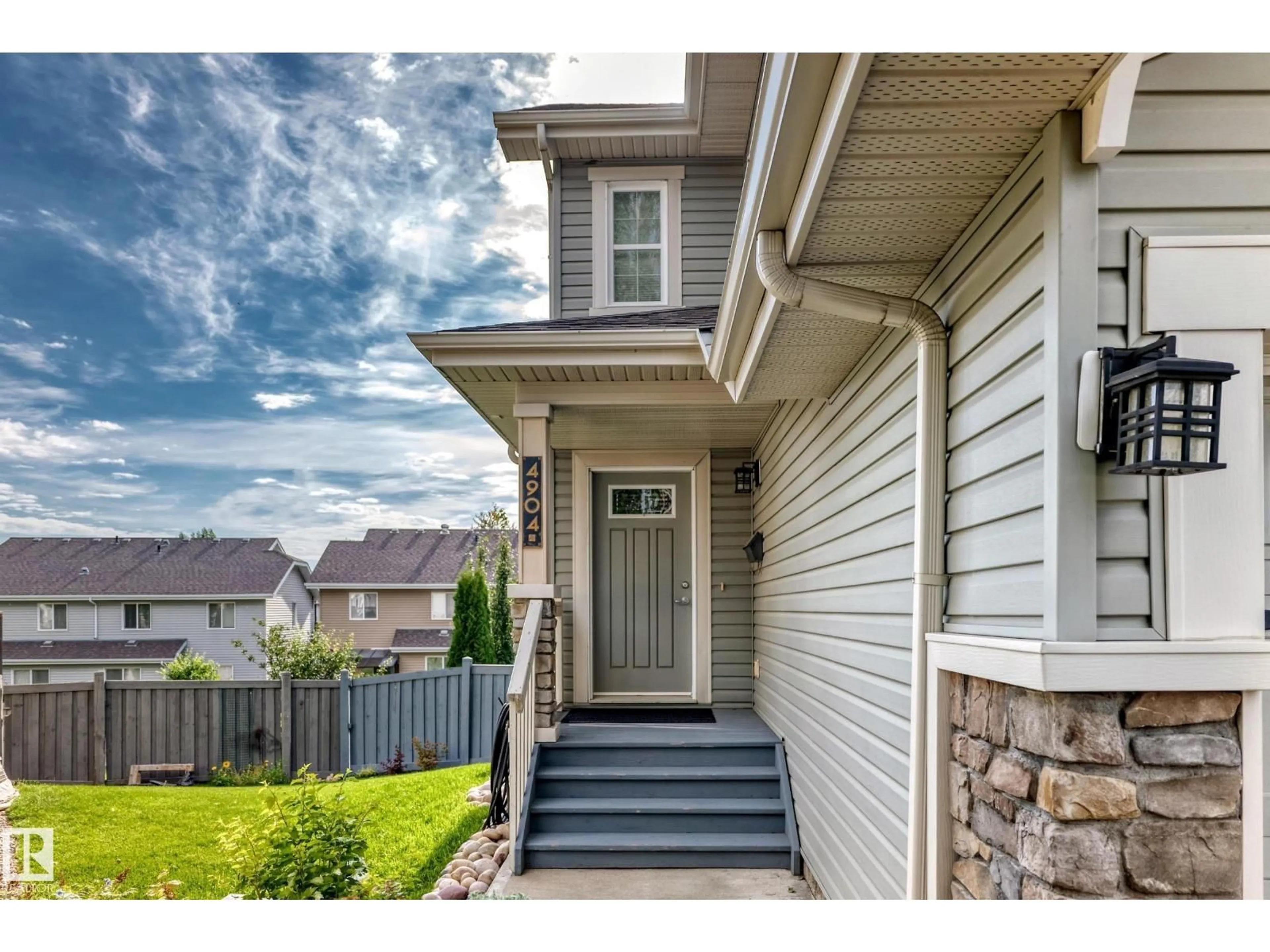 Home with vinyl exterior material, street for NW - 4904 214 ST, Edmonton Alberta T6M0K6