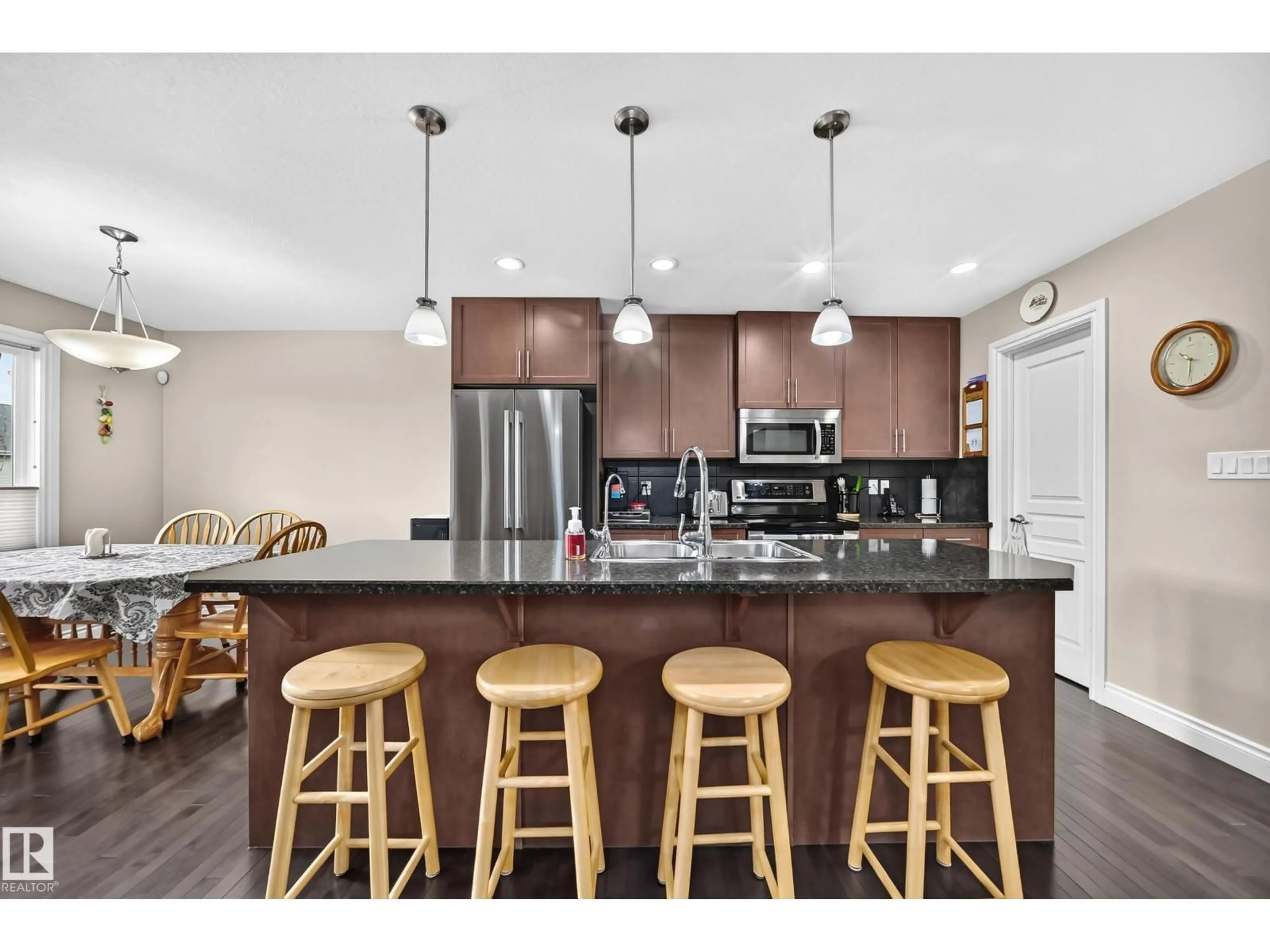 Open concept kitchen, wood/laminate floor for NW - 4904 214 ST, Edmonton Alberta T6M0K6