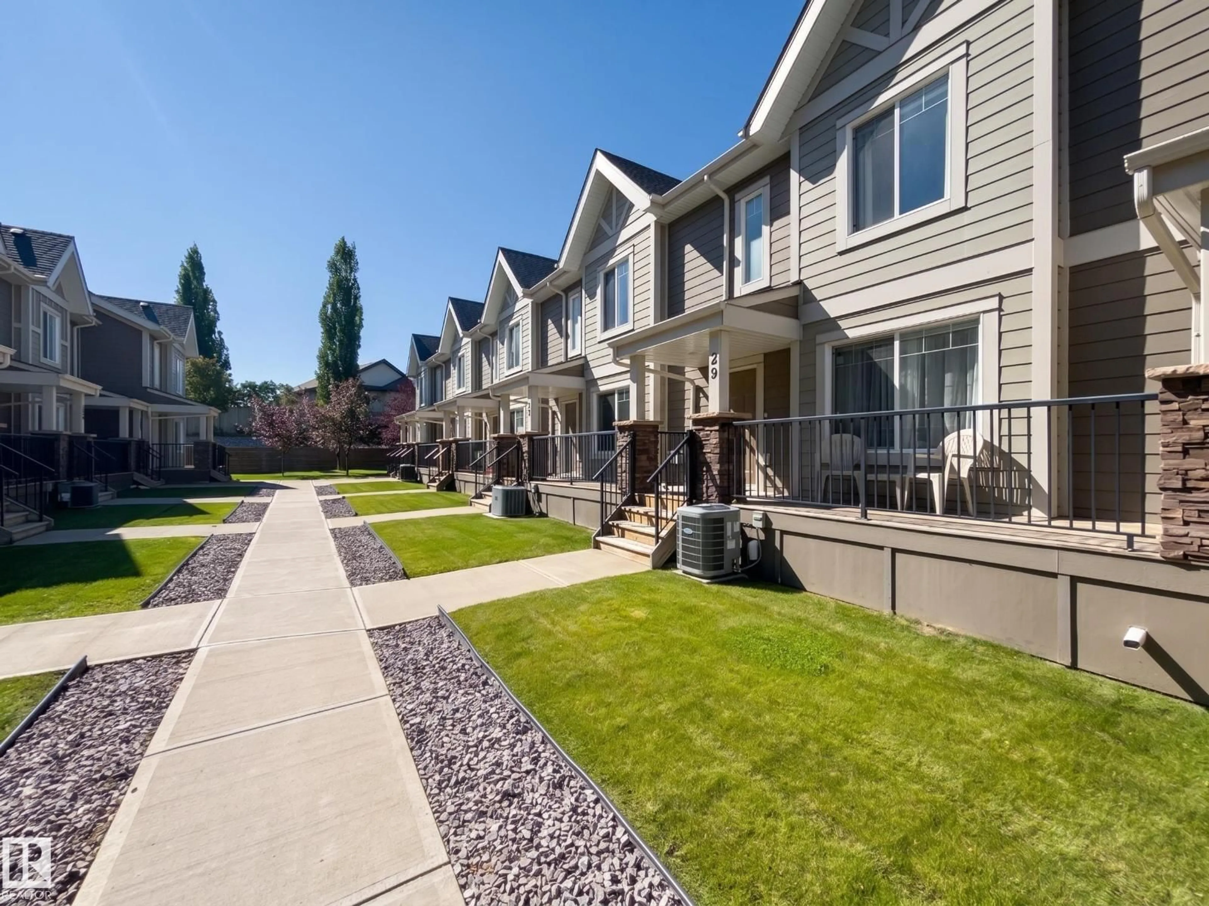 Home with vinyl exterior material, street for 1150 - 29 WINDERMERE WY, Edmonton Alberta T6W2B6