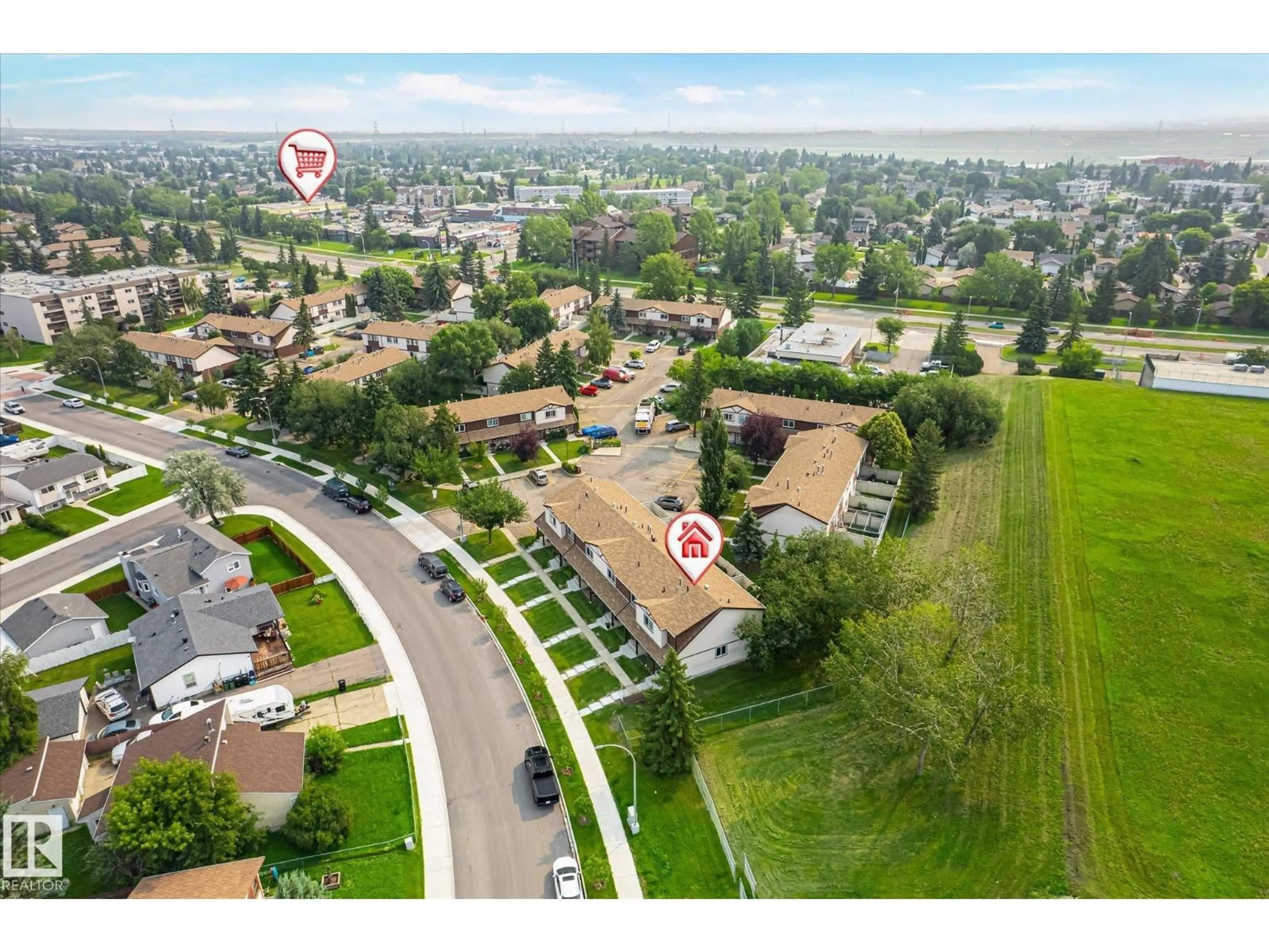 A pic from outside/outdoor area/front of a property/back of a property/a pic from drone, street for #2 - 13833 30 ST NW, Edmonton Alberta T5Y2B2