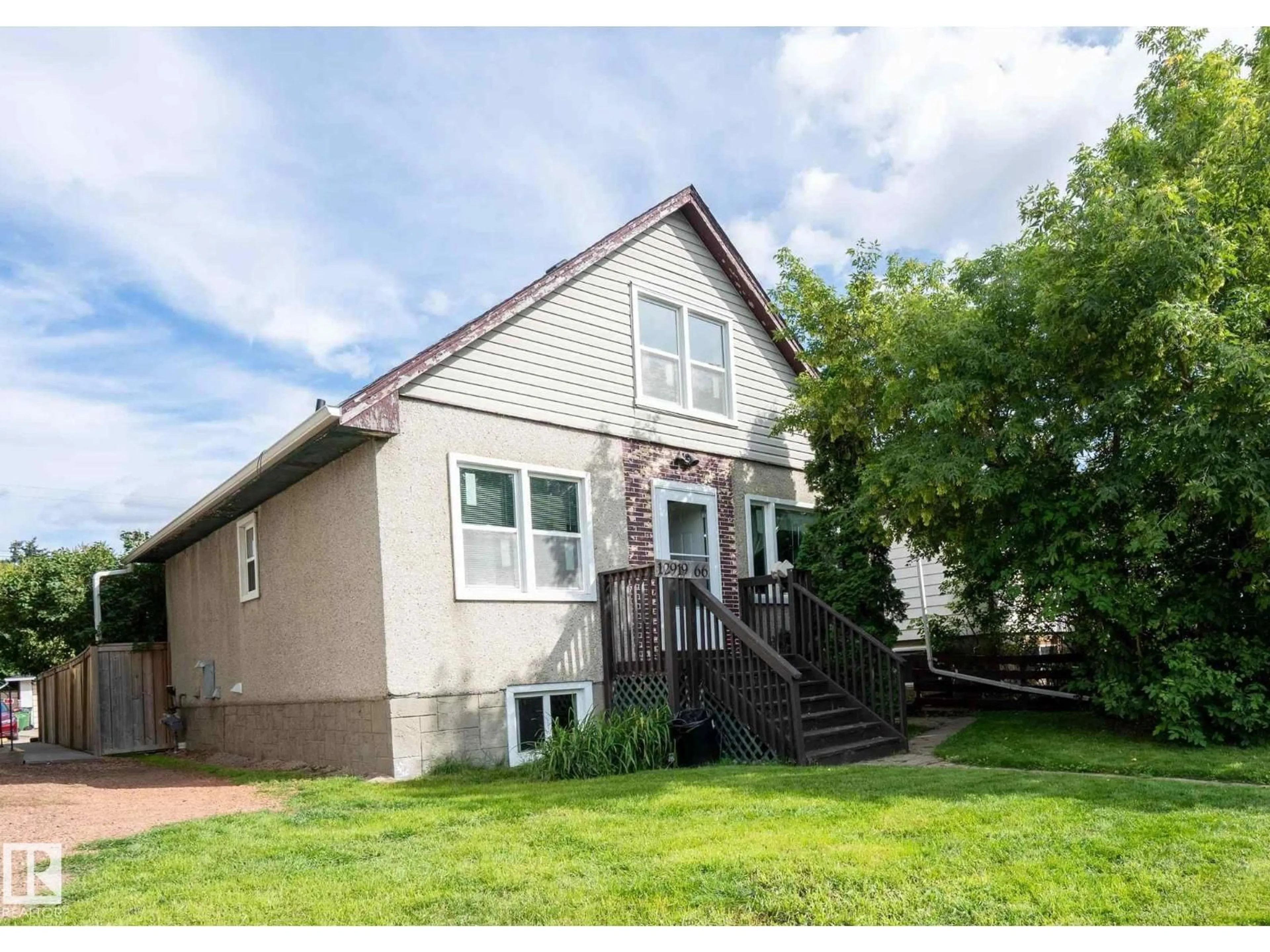 Home with vinyl exterior material, street for 12919 66 ST, Edmonton Alberta T5C0A6