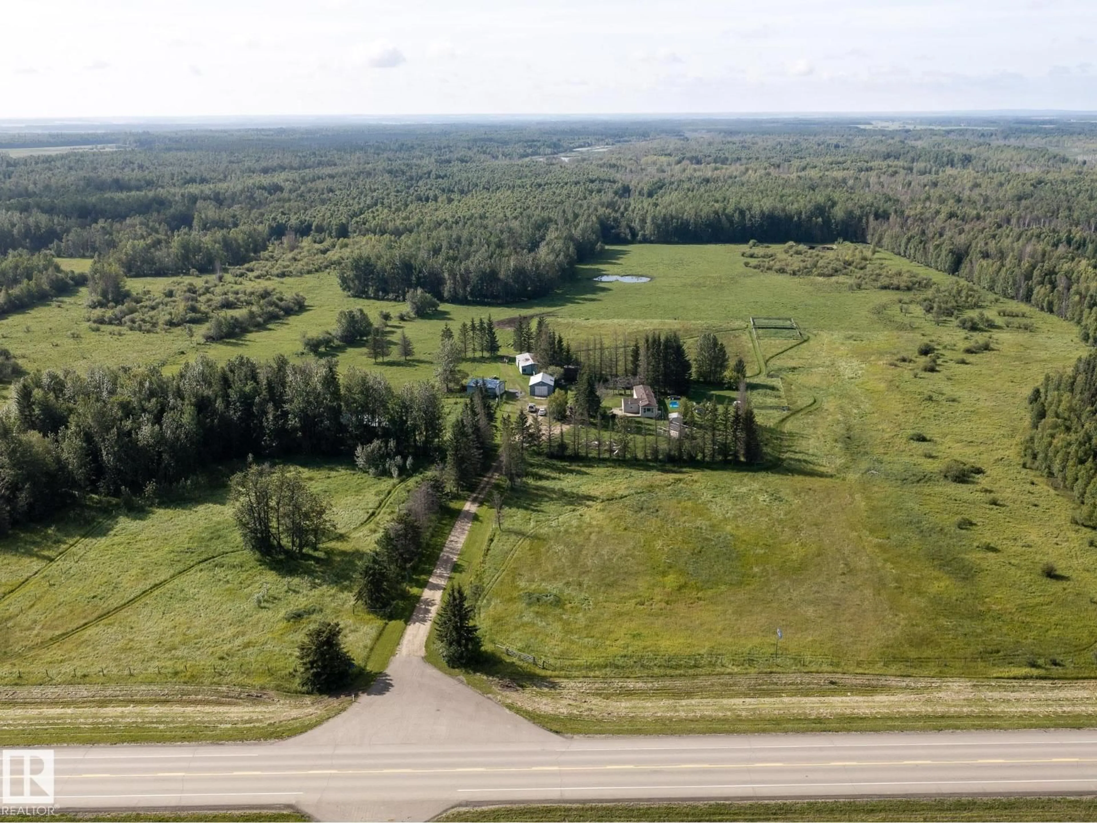 A pic from outside/outdoor area/front of a property/back of a property/a pic from drone, unknown for 214067 HWY 55, Rural Athabasca County Alberta T9S1V7
