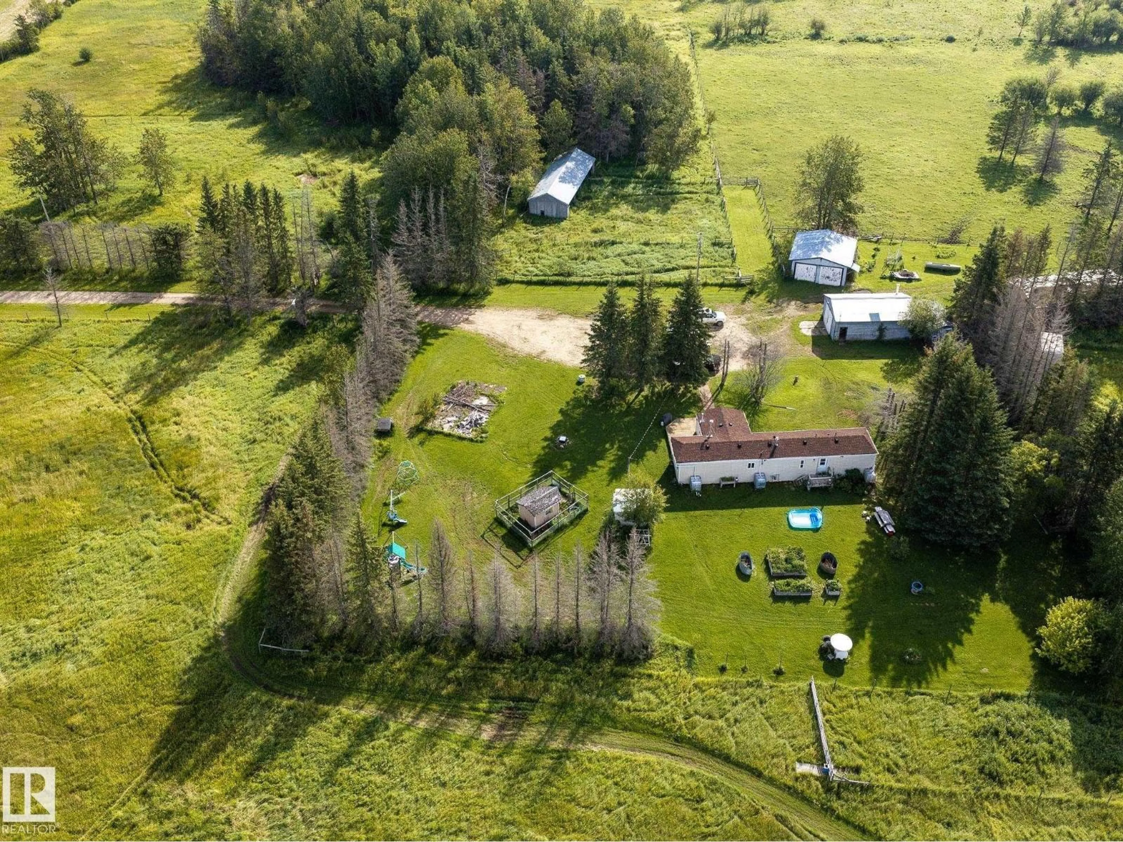 A pic from outside/outdoor area/front of a property/back of a property/a pic from drone, unknown for 214067 HWY 55, Rural Athabasca County Alberta T9S1V7