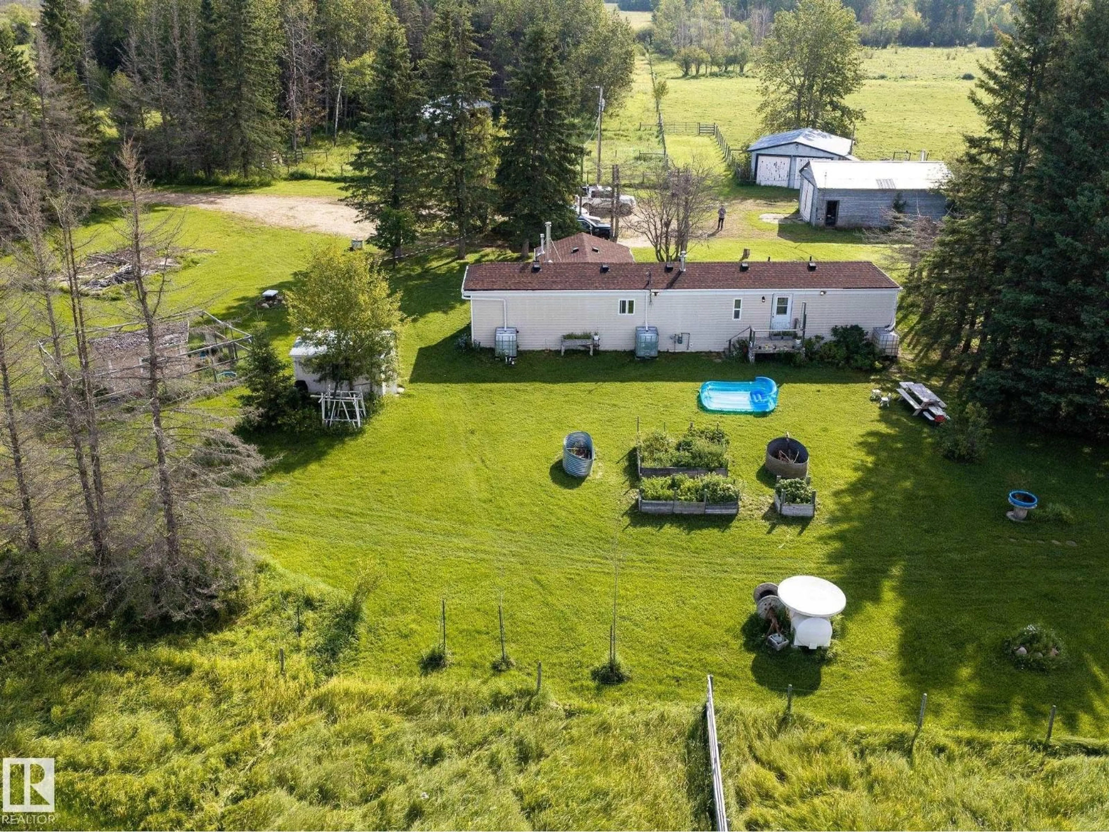 A pic from outside/outdoor area/front of a property/back of a property/a pic from drone, unknown for 214067 HWY 55, Rural Athabasca County Alberta T9S1V7