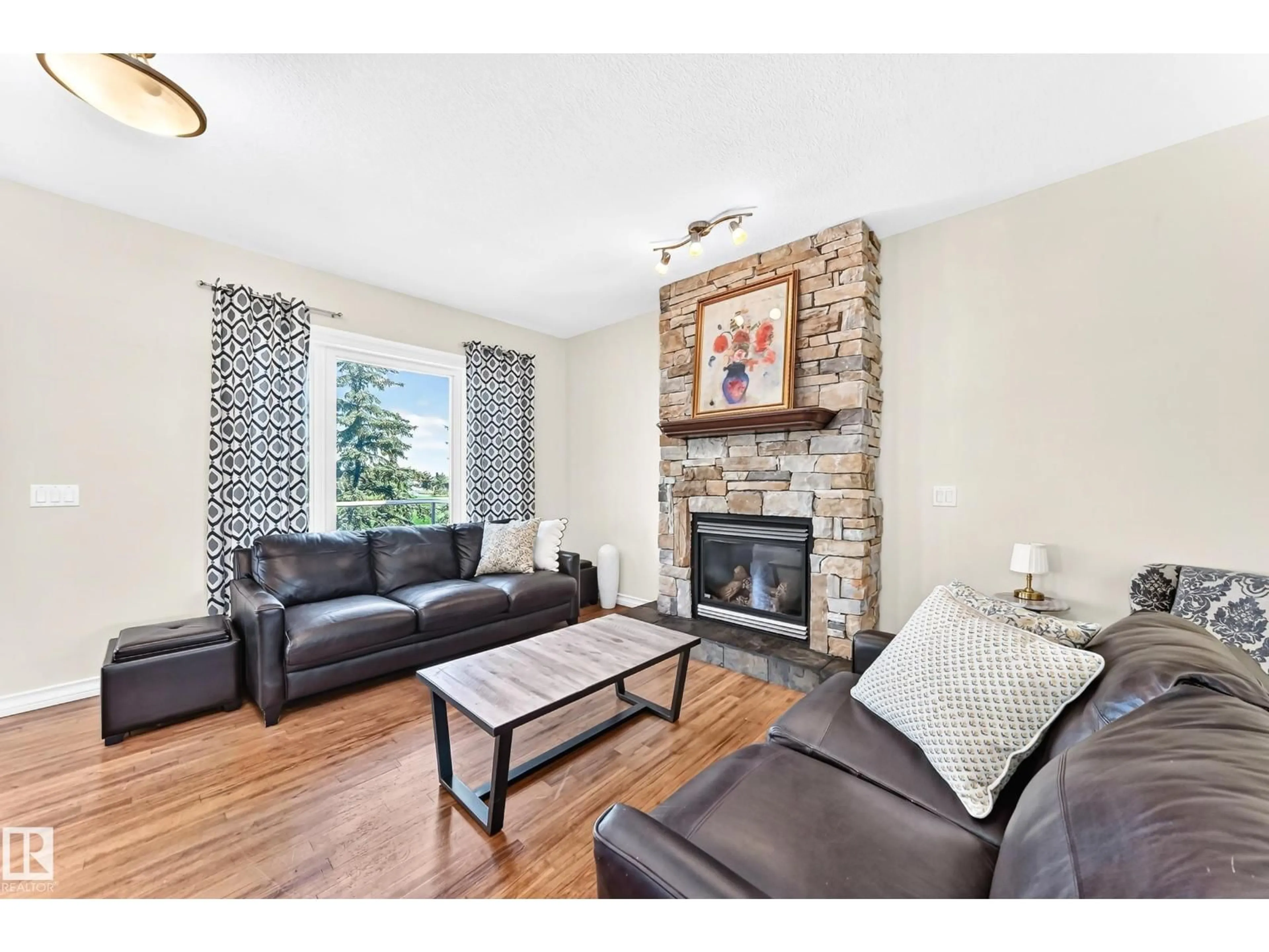 Living room with furniture, wood/laminate floor for 428 FORREST DR, Sherwood Park Alberta T8A6L2