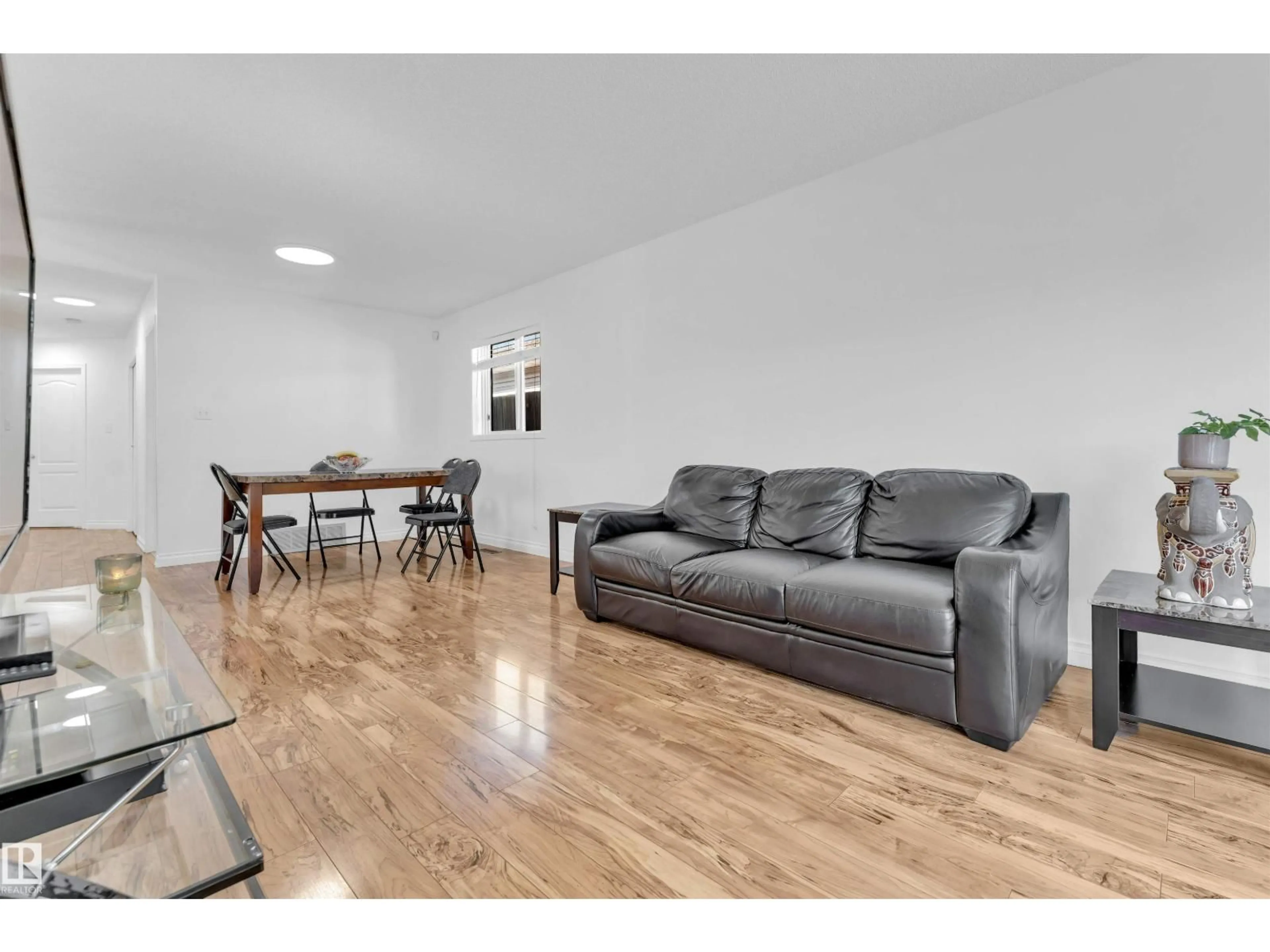 Living room with furniture, wood/laminate floor for 274 KIRKWOOD AV, Edmonton Alberta T6L5A8