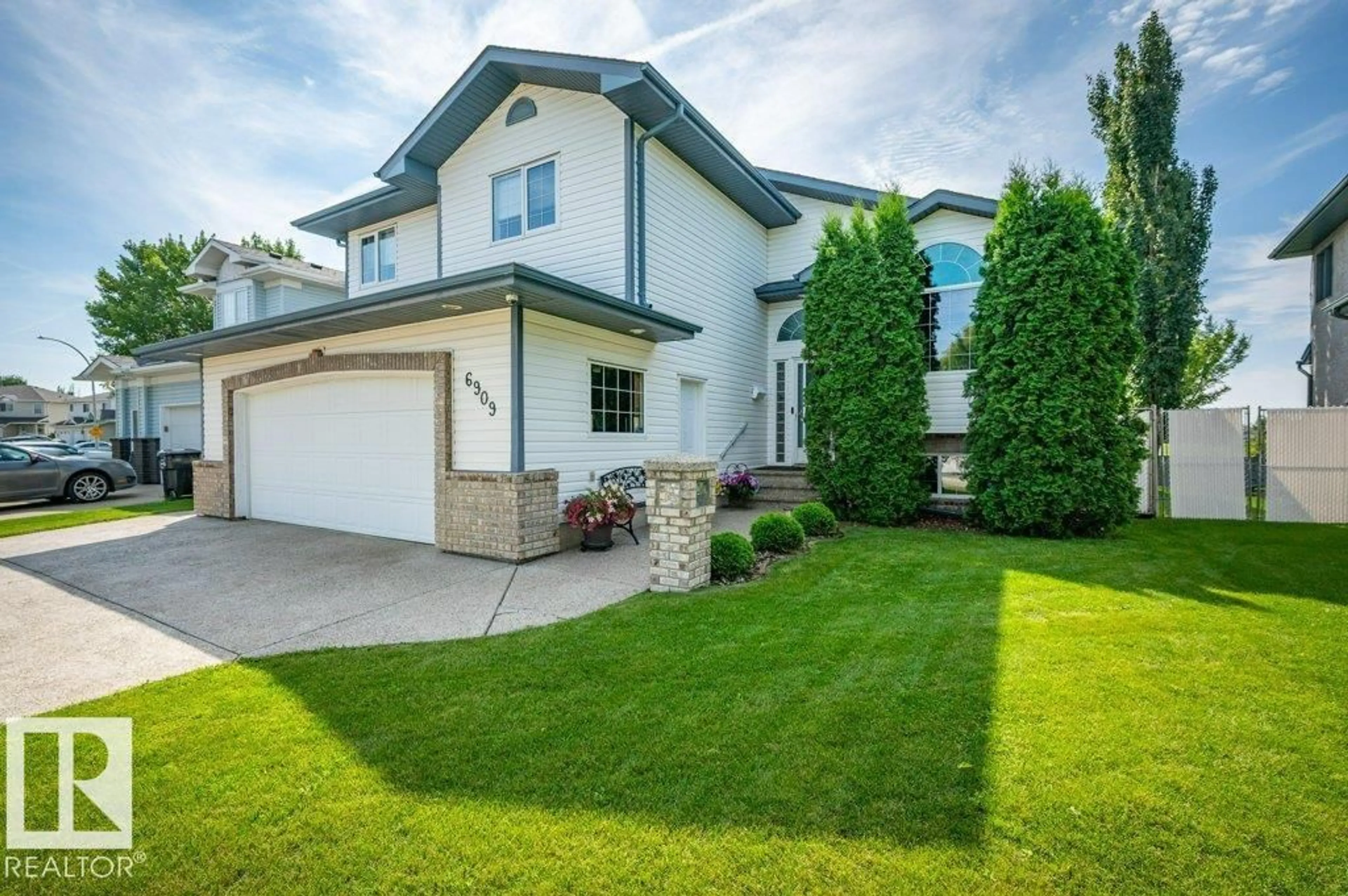 Home with vinyl exterior material, street for 6909 159A AV NW, Edmonton Alberta T5Z3B2