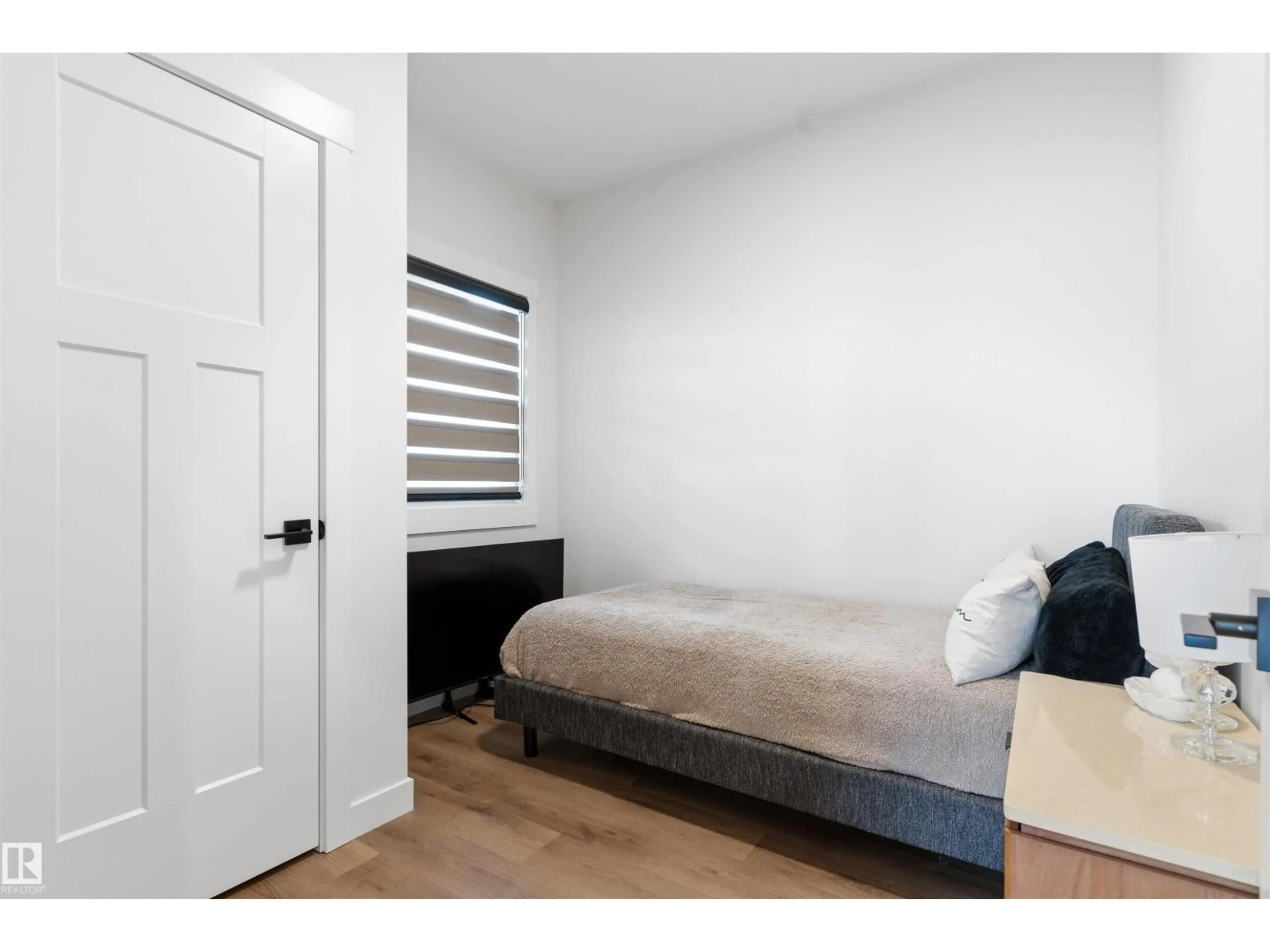 Bedroom with bed, wood/laminate floor for NW - 22328 88 AV, Edmonton Alberta T5T7Y3