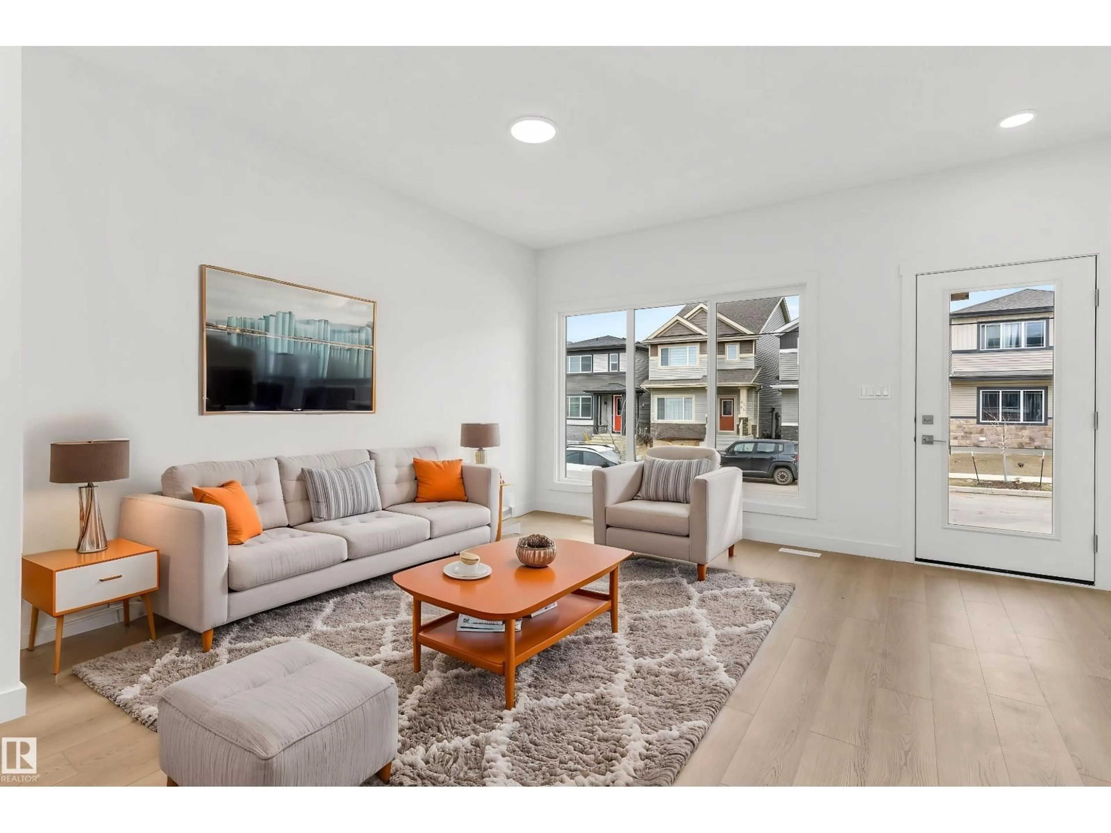 Living room with furniture, wood/laminate floor for NW - 1617 210A ST, Edmonton Alberta T6M3N9