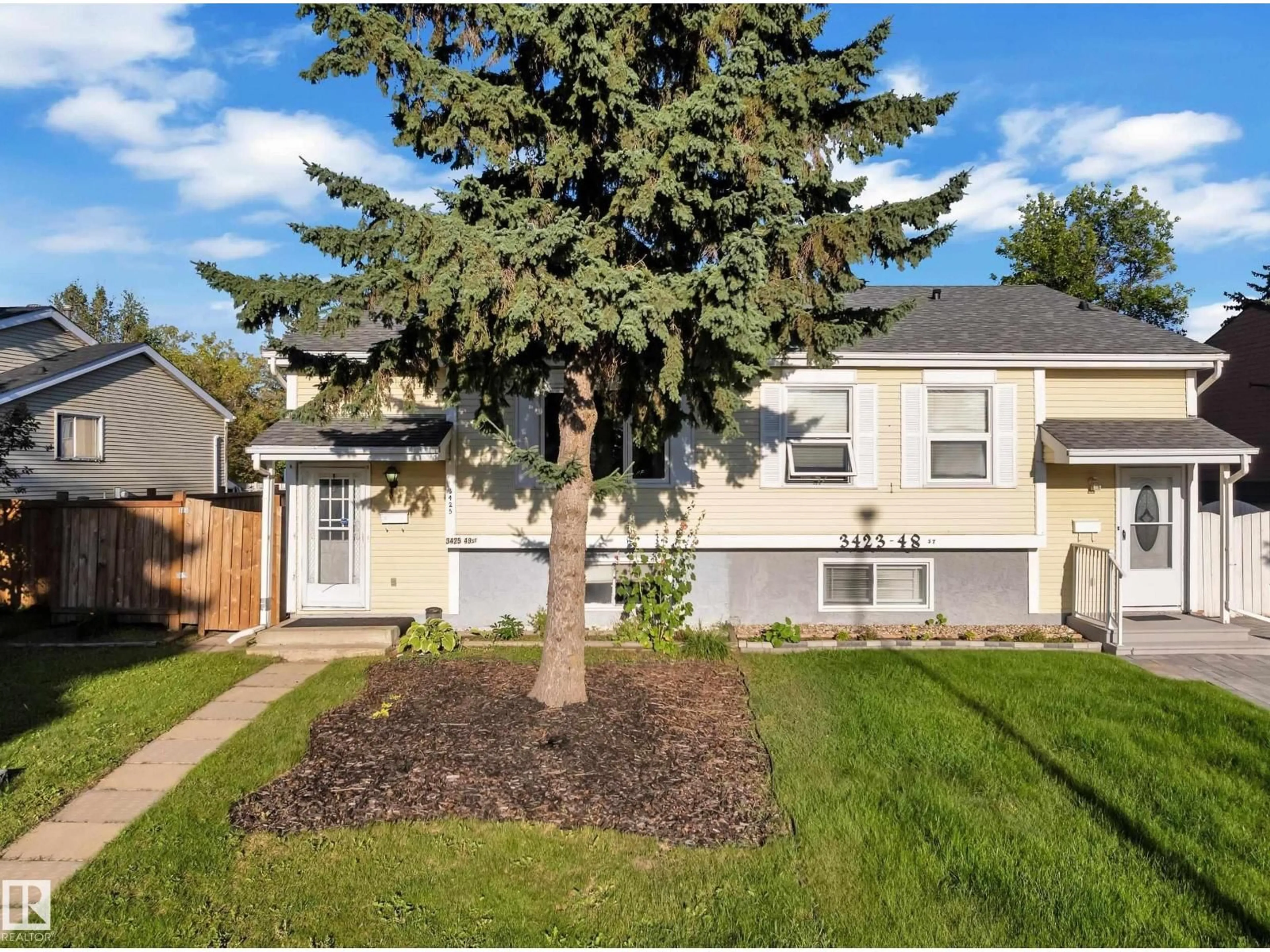 Home with vinyl exterior material, street for NW - 3425 48 ST, Edmonton Alberta T6L3R2