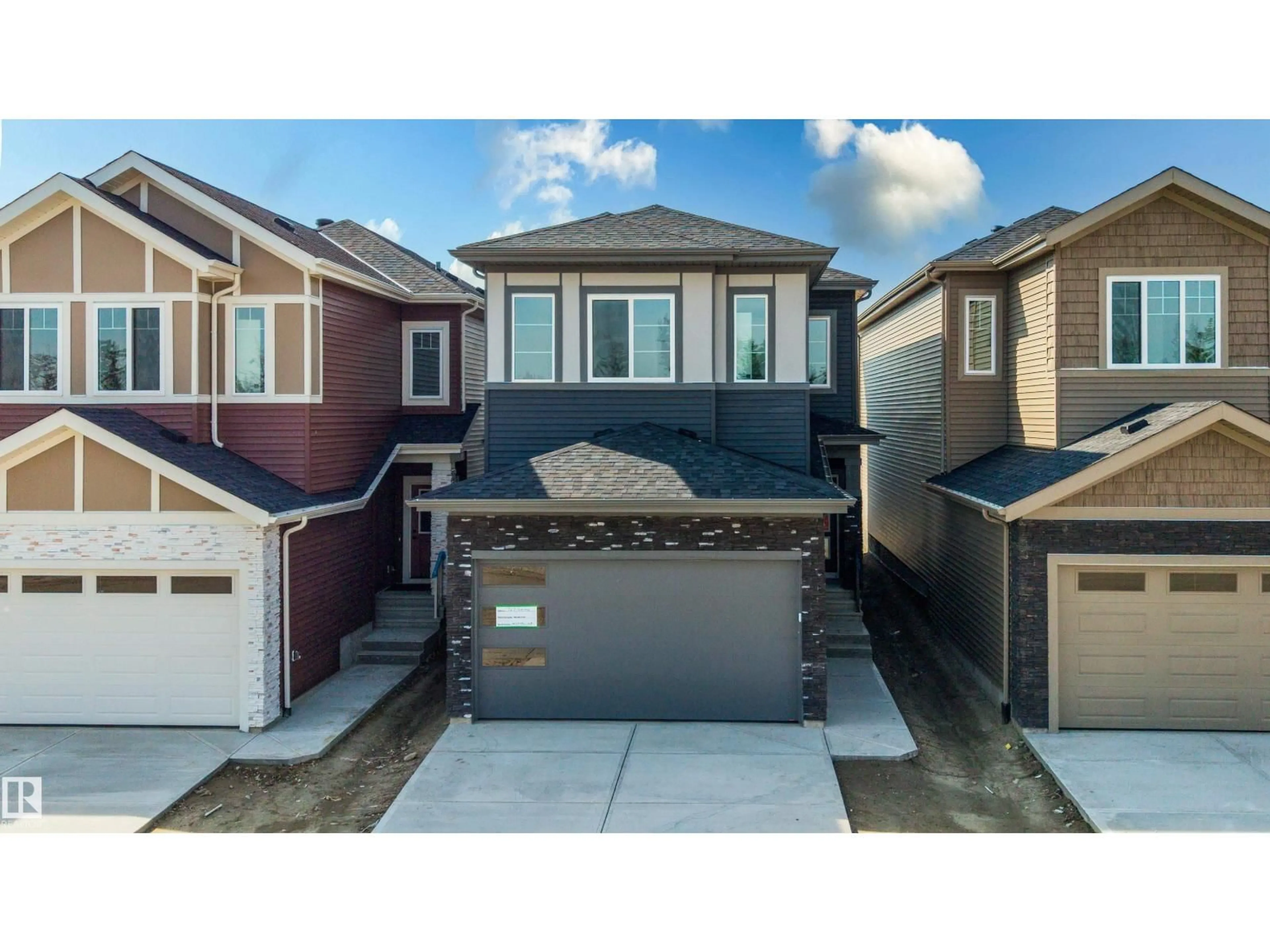 Home with vinyl exterior material, street for NE - 727 158 AV, Edmonton Alberta T5Y4M9