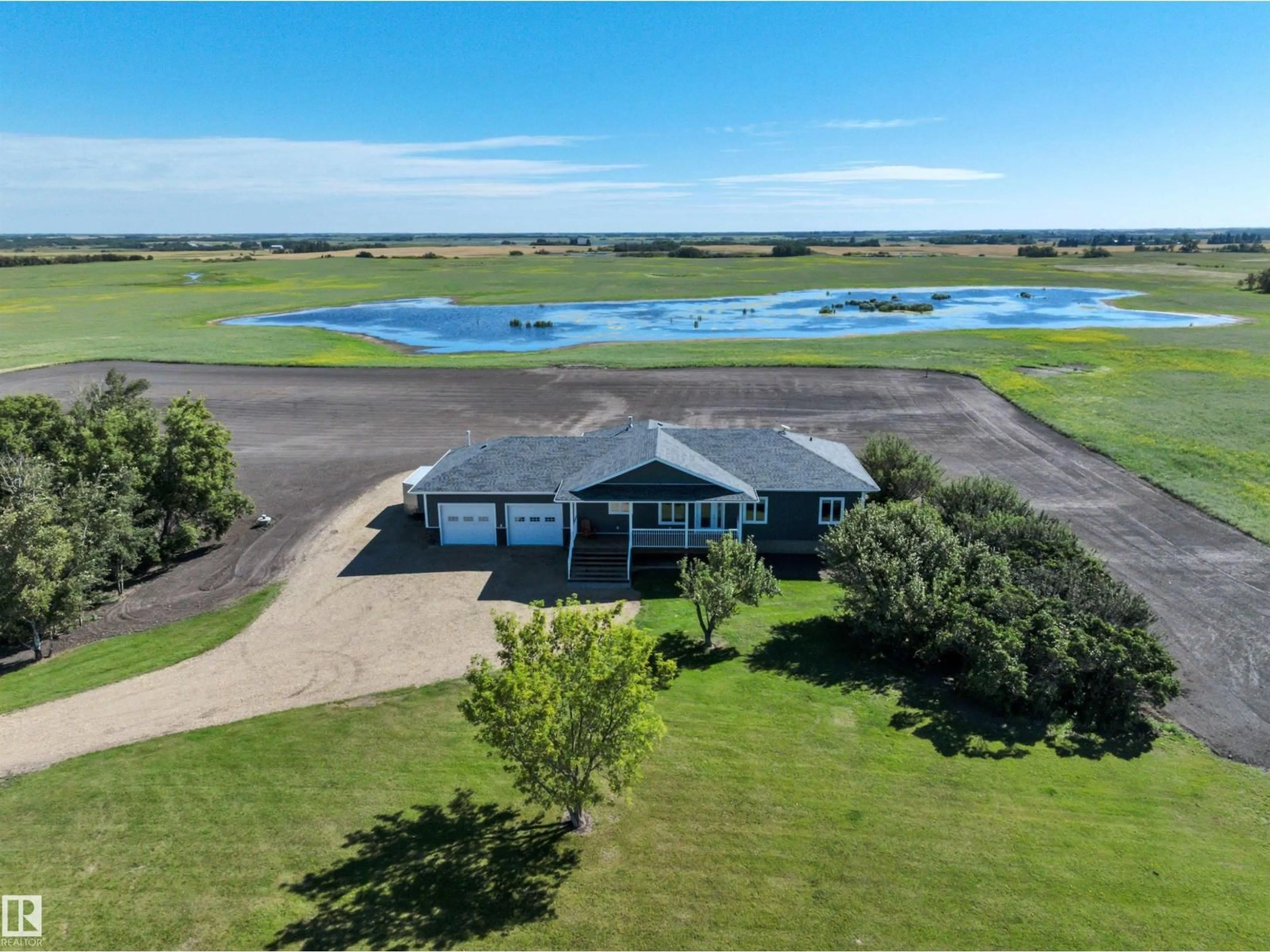 A pic from outside/outdoor area/front of a property/back of a property/a pic from drone, water/lake/river/ocean view for 48315 HIGHWAY 834, Rural Camrose County Alberta T0B2M2