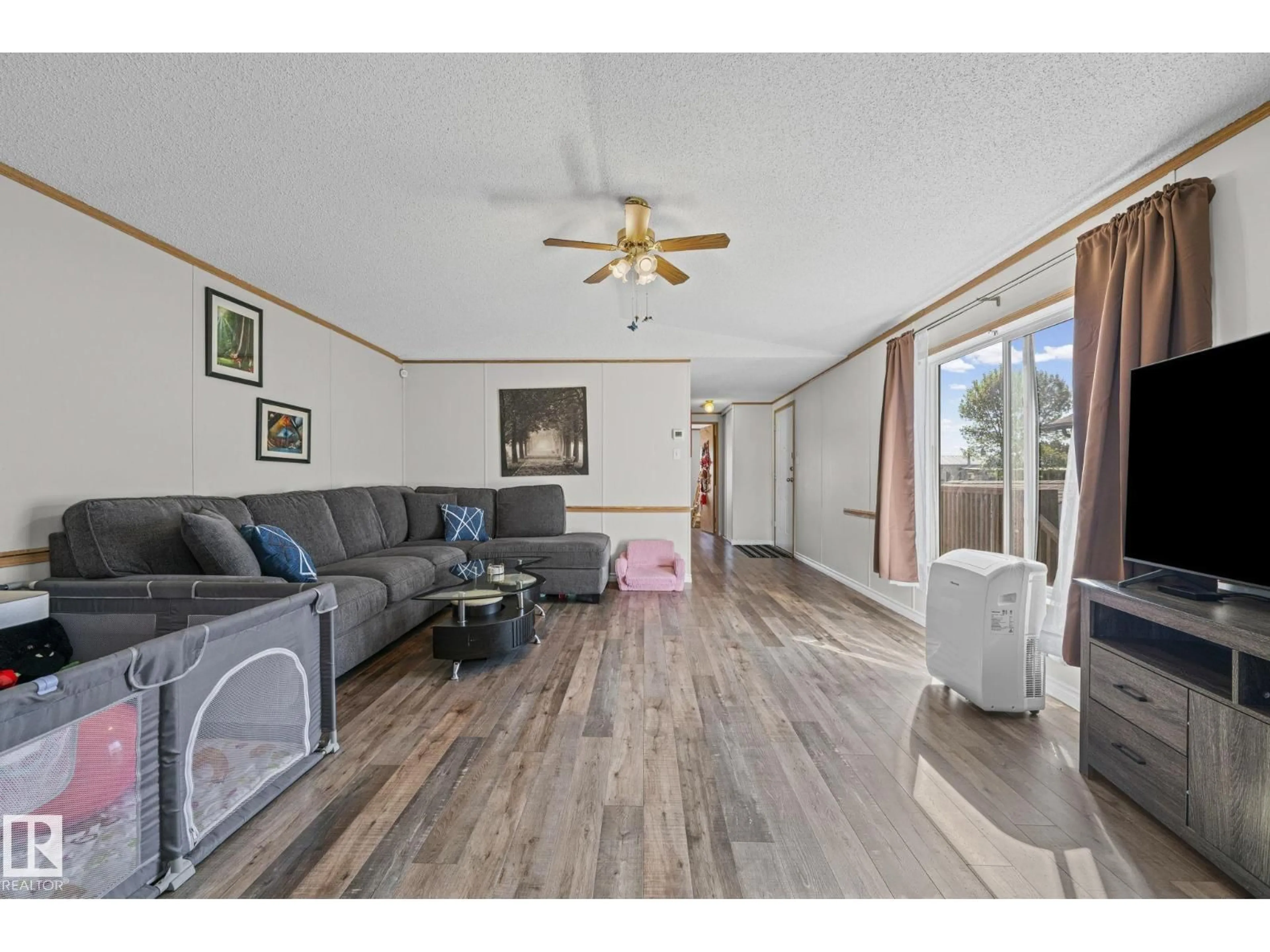 Living room with furniture, wood/laminate floor for 89 SPRINGFIELD CR, Spruce Grove Alberta T7X3H9