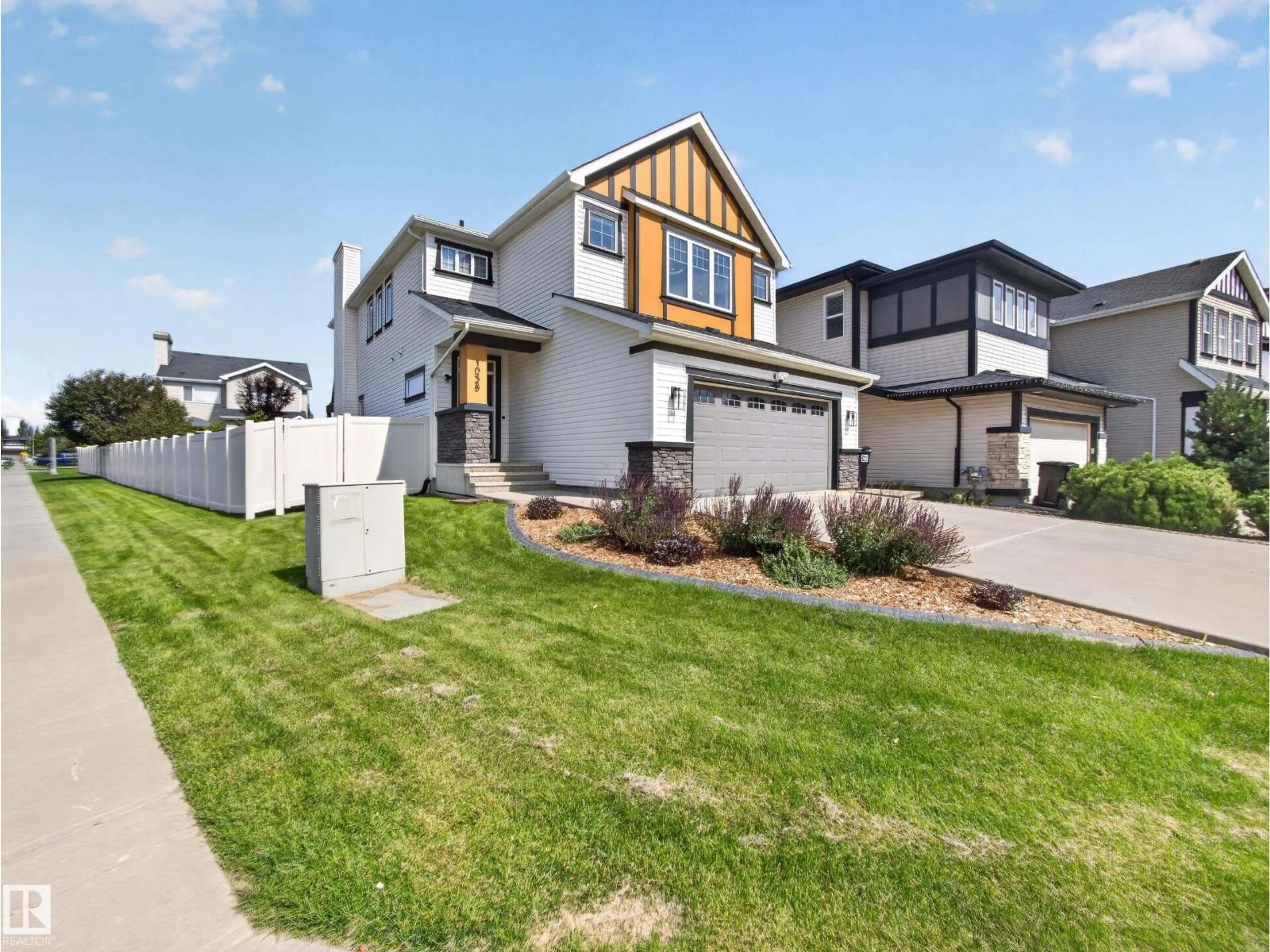 Home with vinyl exterior material, street for PM NW - 1038 SECORD PROMENADE, Edmonton Alberta T5T4N3