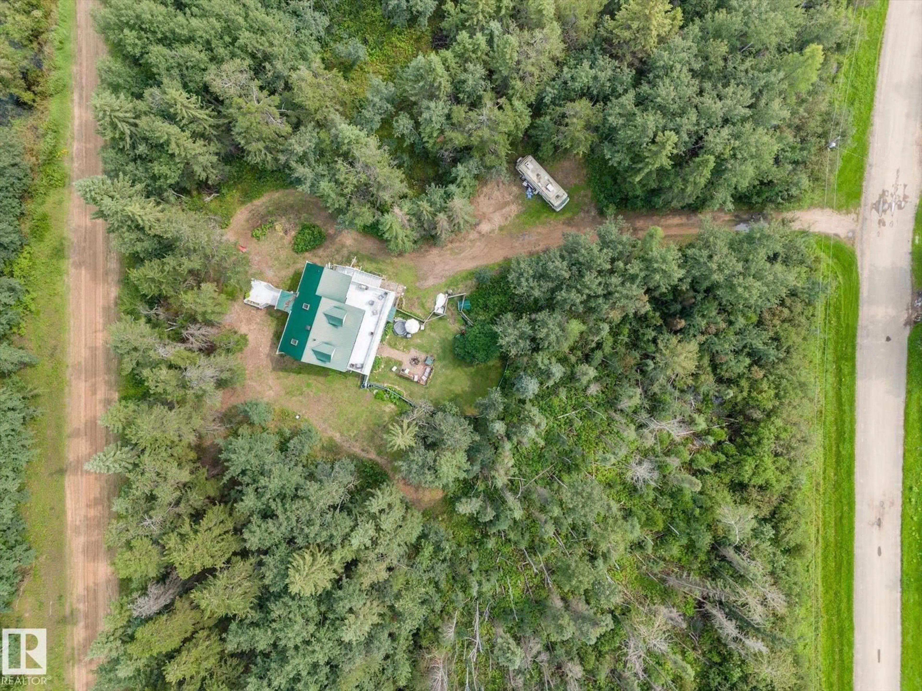 A pic from outside/outdoor area/front of a property/back of a property/a pic from drone, forest/trees view for 2 - 59031 RANGE RD 232, Rural Thorhild County Alberta T0A2W0