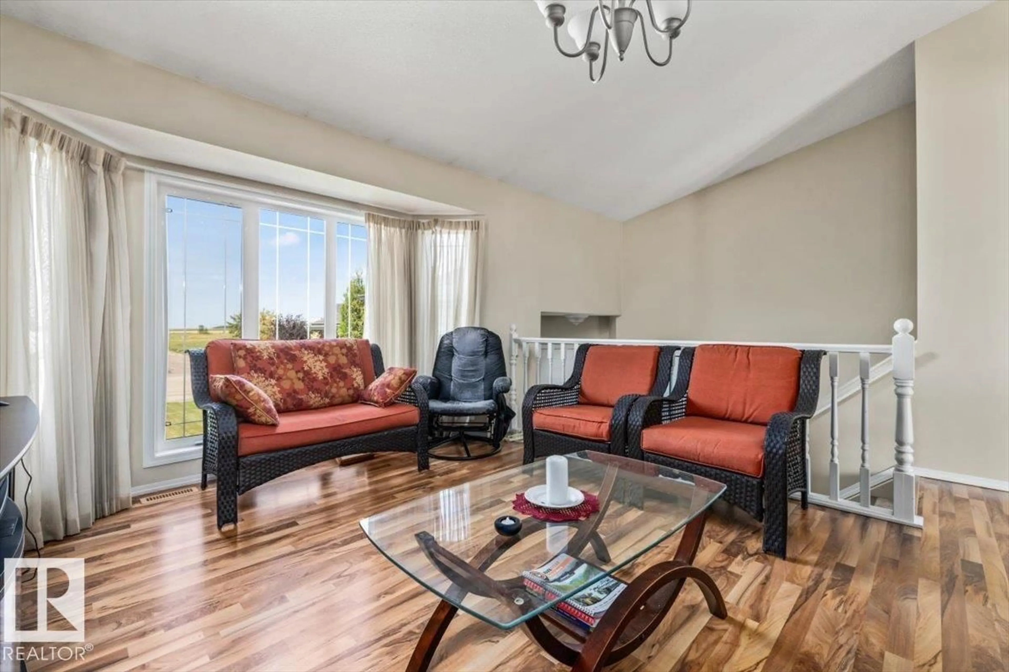 Living room with furniture, wood/laminate floor for 4423 56 AV, Lamont Alberta T0B0B2