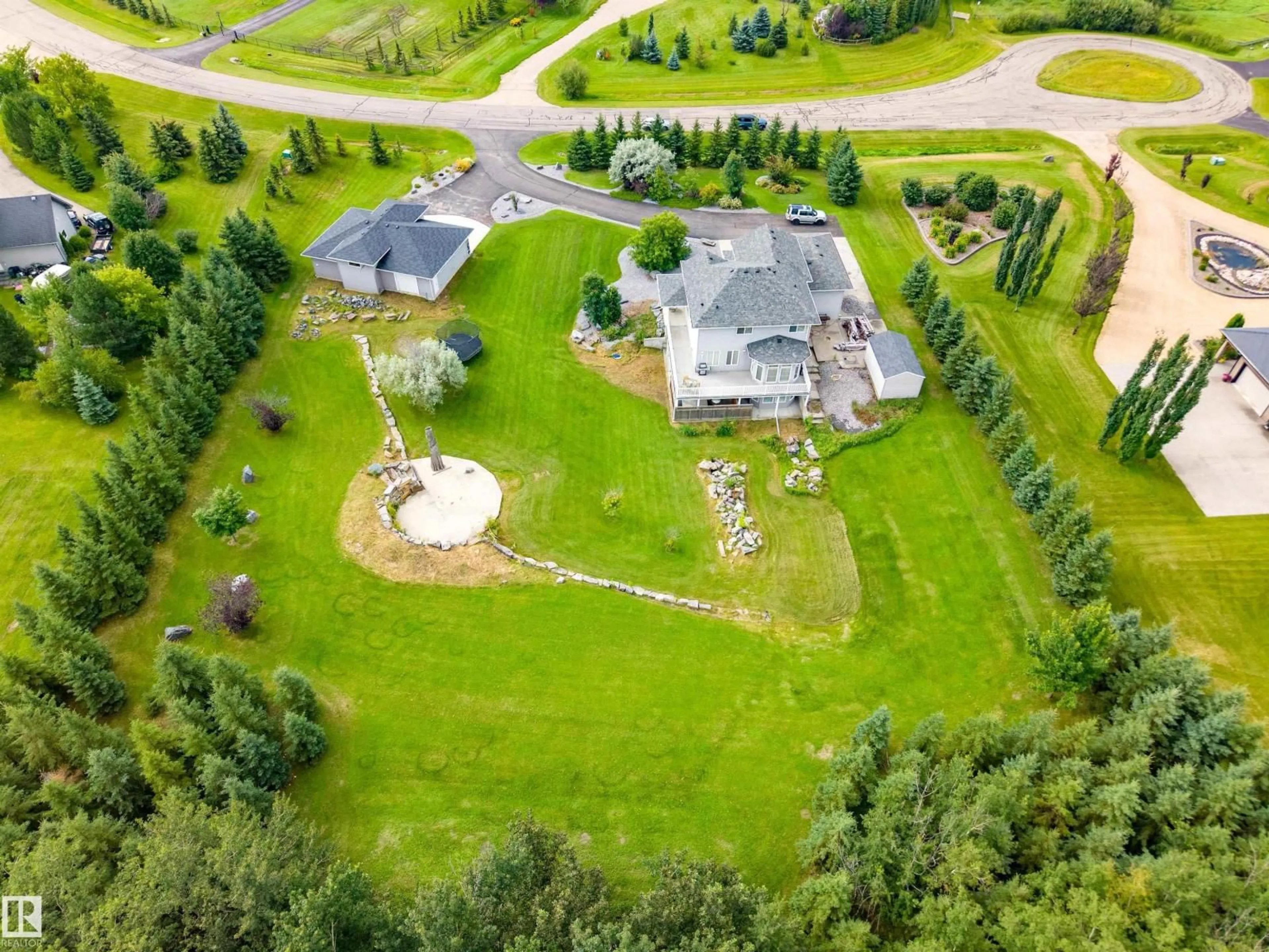 A pic from outside/outdoor area/front of a property/back of a property/a pic from drone, unknown for 170 53016 RGE ROAD 222, Rural Strathcona County Alberta T8E1J8