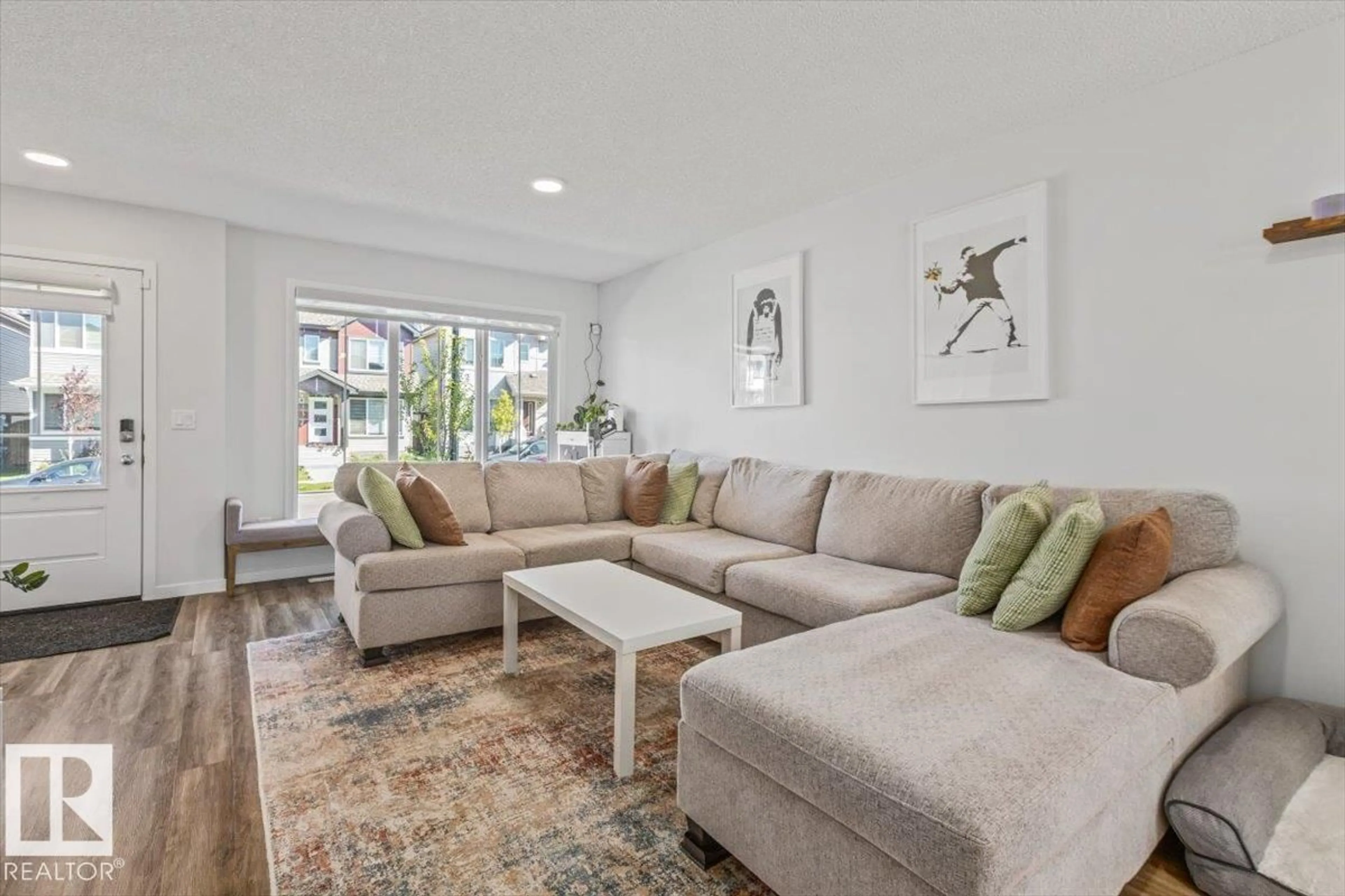 Living room with furniture, unknown for 6259 176 AV, Edmonton Alberta T5Y4E5