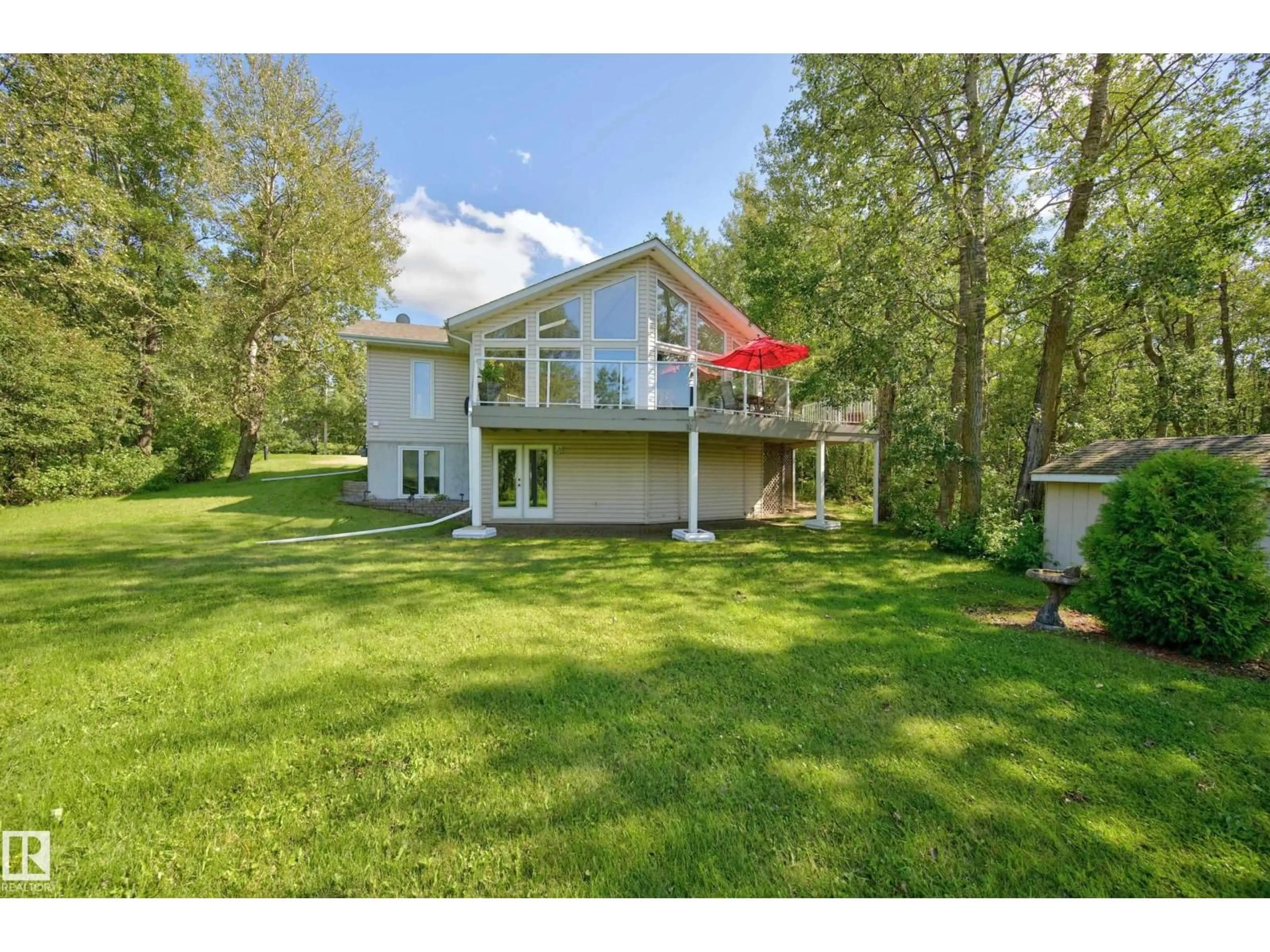 A pic from outside/outdoor area/front of a property/back of a property/a pic from drone, water/lake/river/ocean view for 53 - 53 RGE ROAD 204 RGE ROAD, Rural Strathcona County Alberta T8G1E9