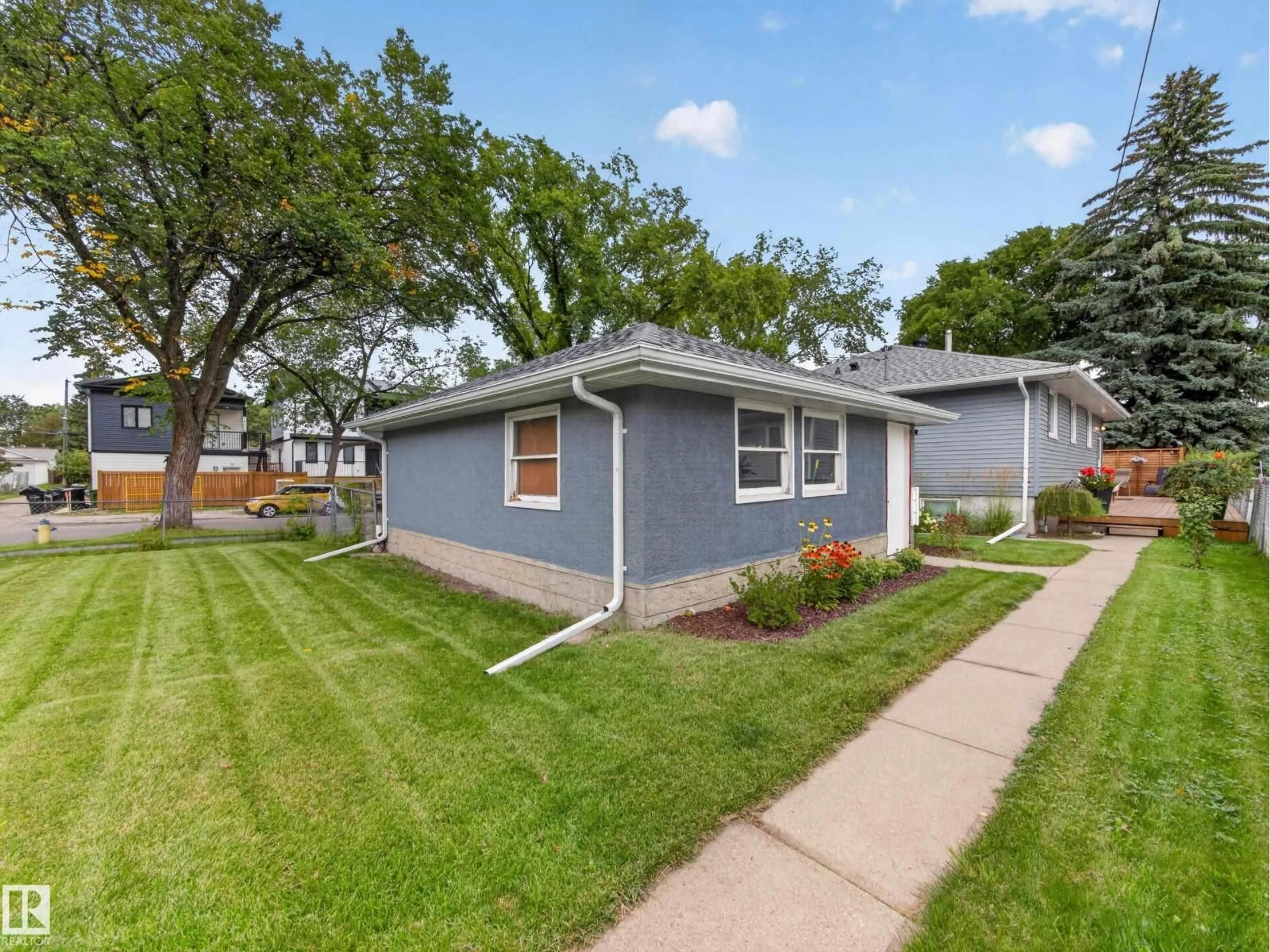 Home with vinyl exterior material, street for NW - 14003 123A AV, Edmonton Alberta T5L2Z3
