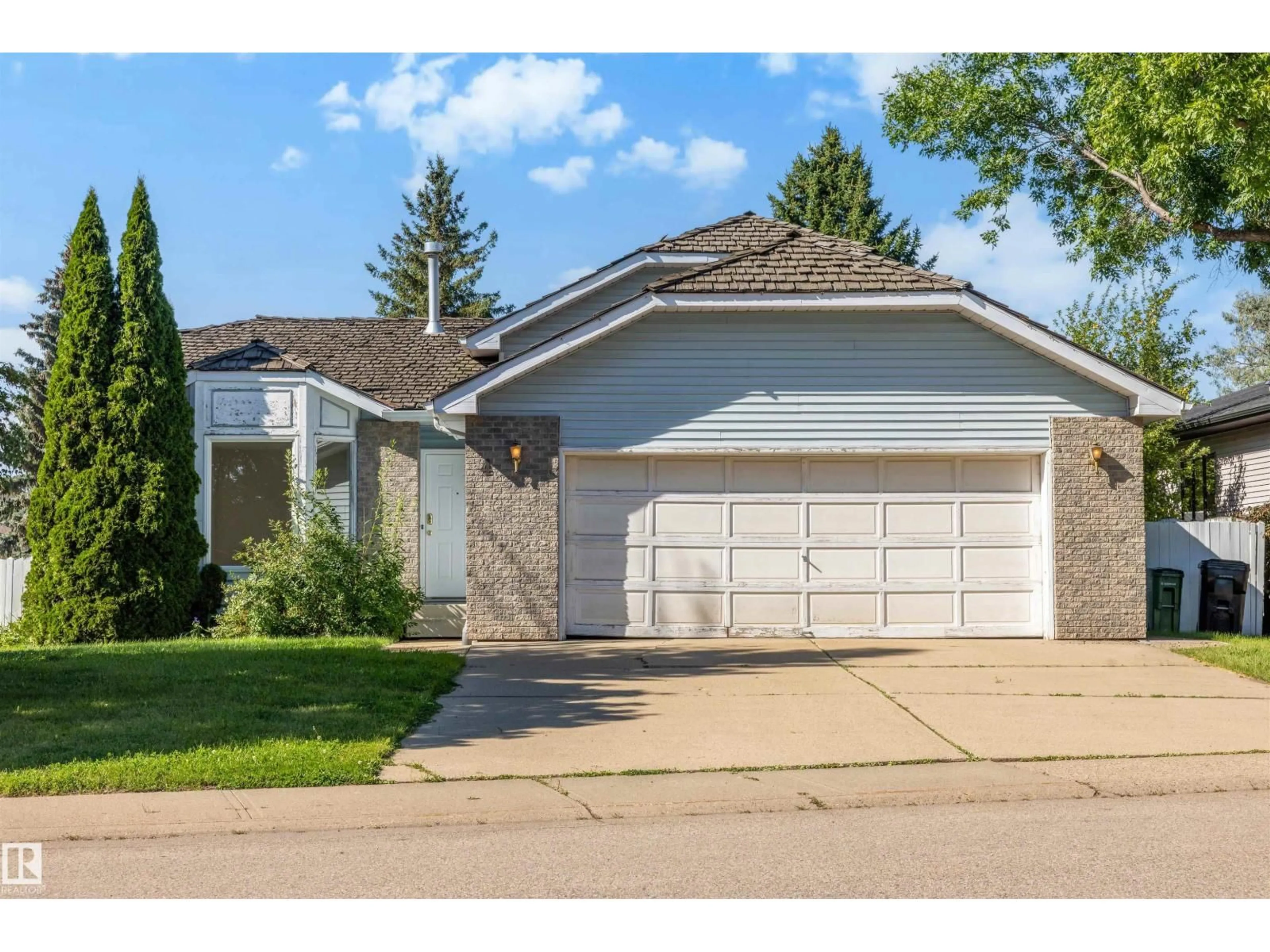 Home with vinyl exterior material, street for 4 BLUE QUILL CR, Edmonton Alberta T6J6C2