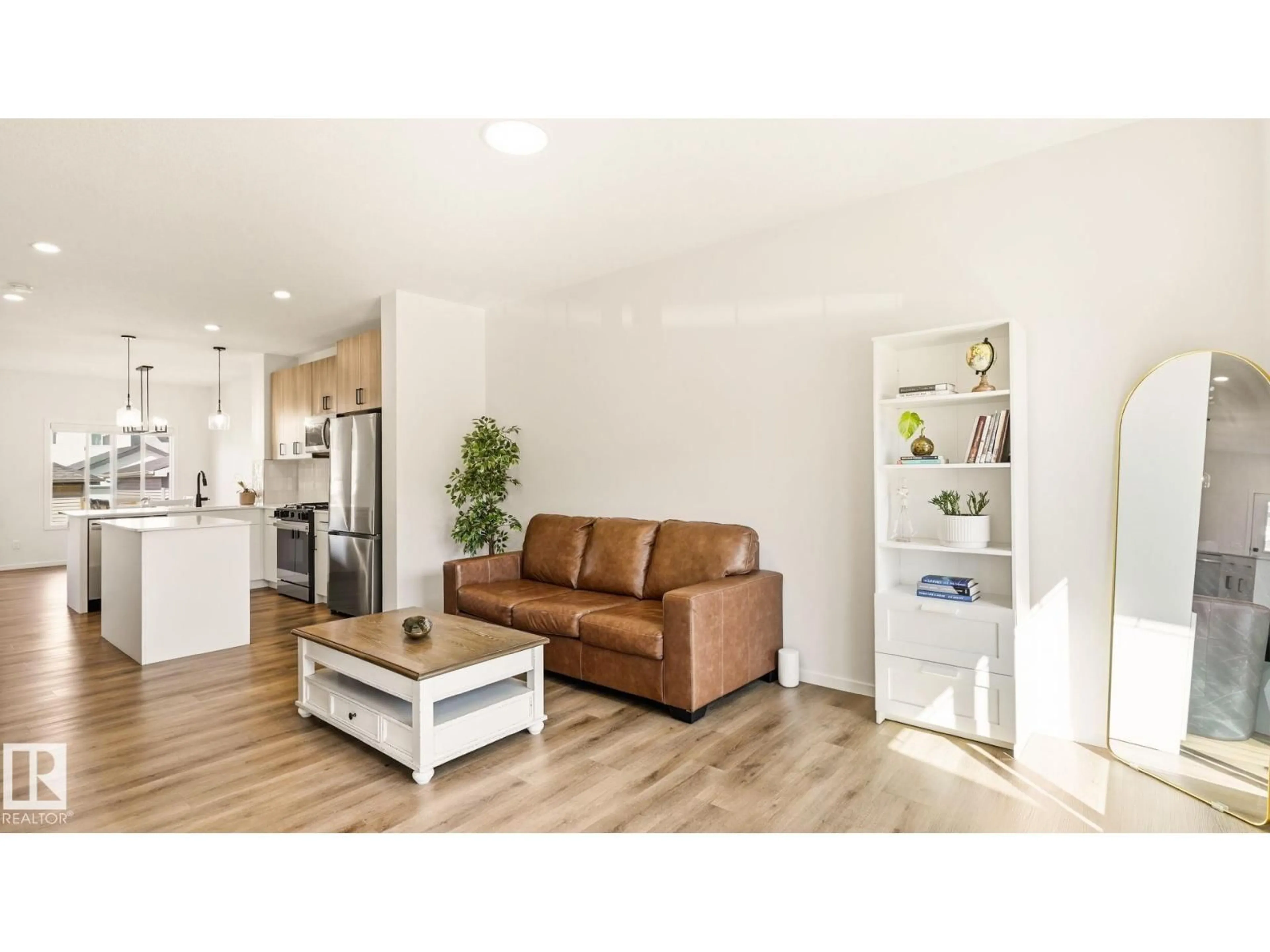 Living room with furniture, wood/laminate floor for NW - 2804 193 ST, Edmonton Alberta T6M3B2