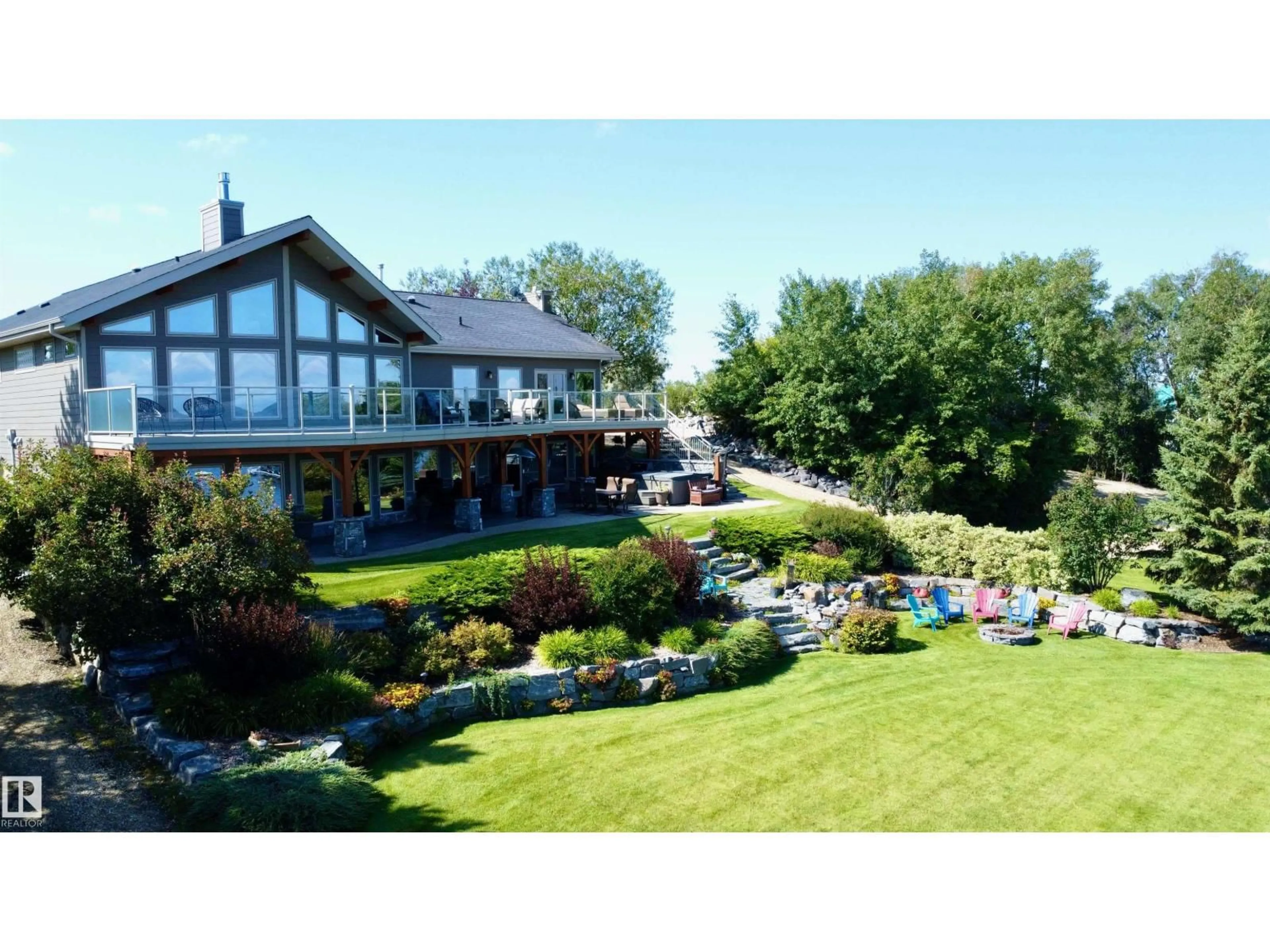 A pic from outside/outdoor area/front of a property/back of a property/a pic from drone, mountain view for #8 & 9 - 52506 RGE ROAD 50, Rural Parkland County Alberta T0E2B0