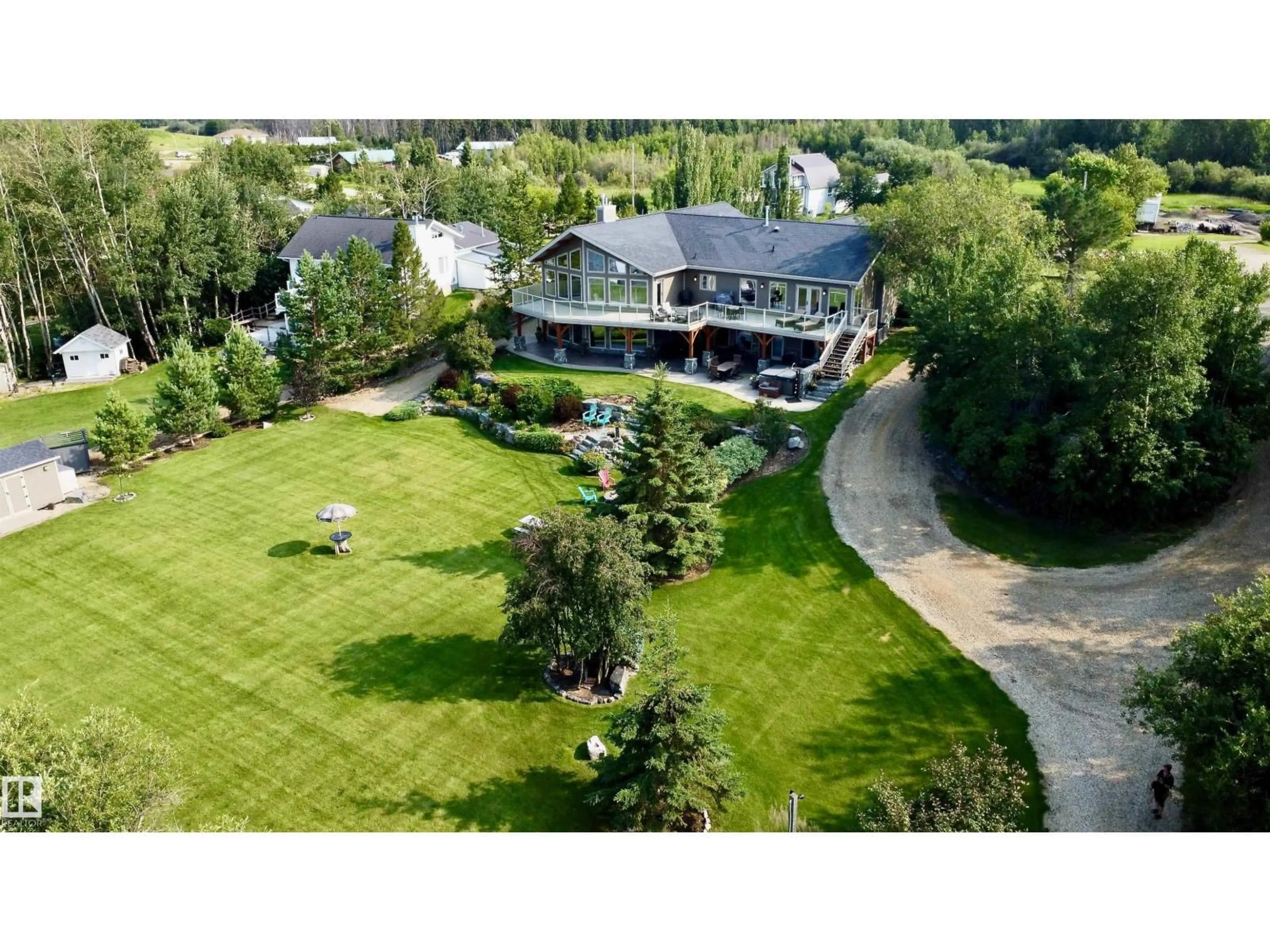 A pic from outside/outdoor area/front of a property/back of a property/a pic from drone, mountain view for #8 & 9 - 52506 RGE ROAD 50, Rural Parkland County Alberta T0E2B0