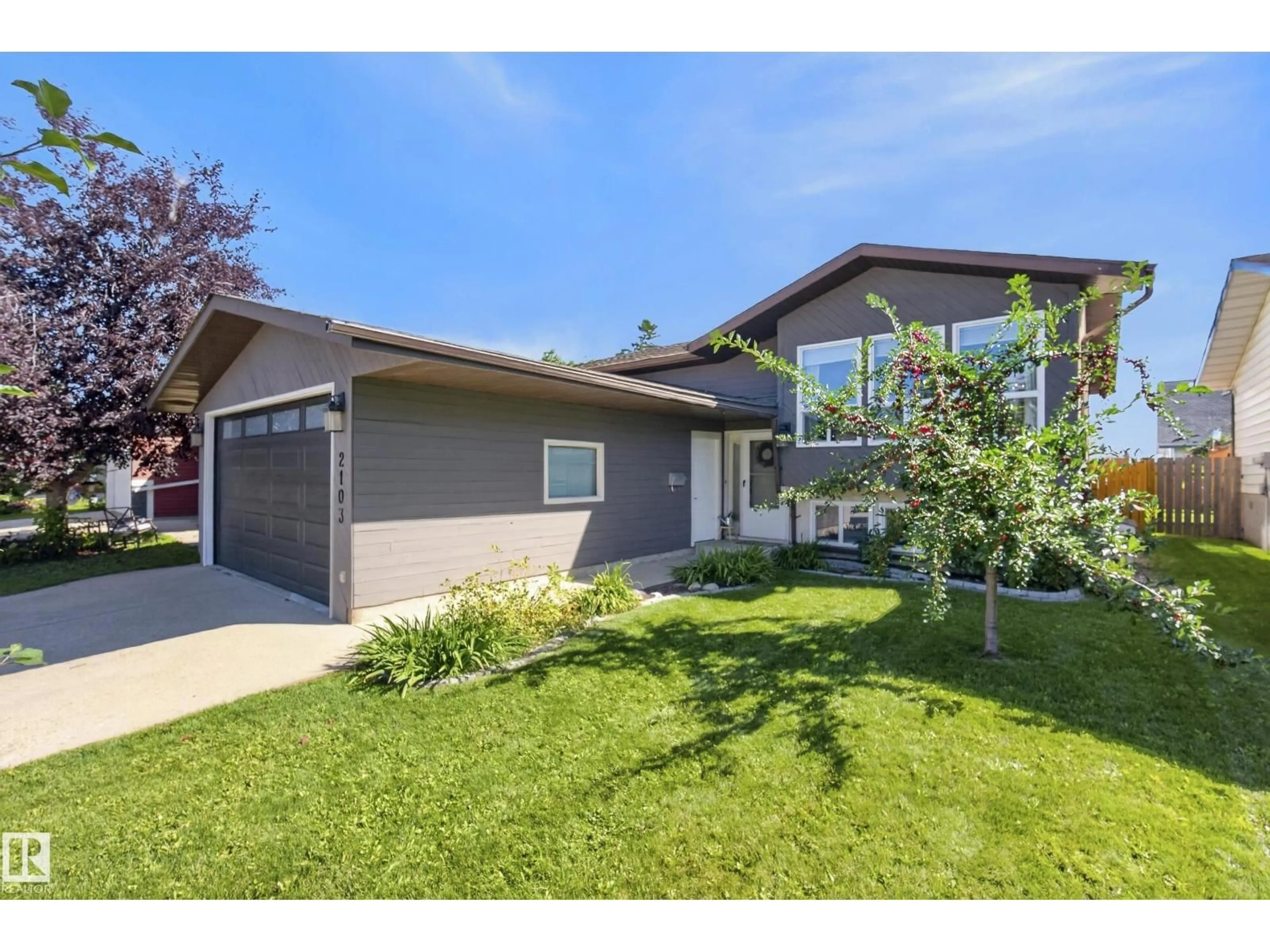 Home with vinyl exterior material, street for 2103 49A ST, Edmonton Alberta T6L2W9